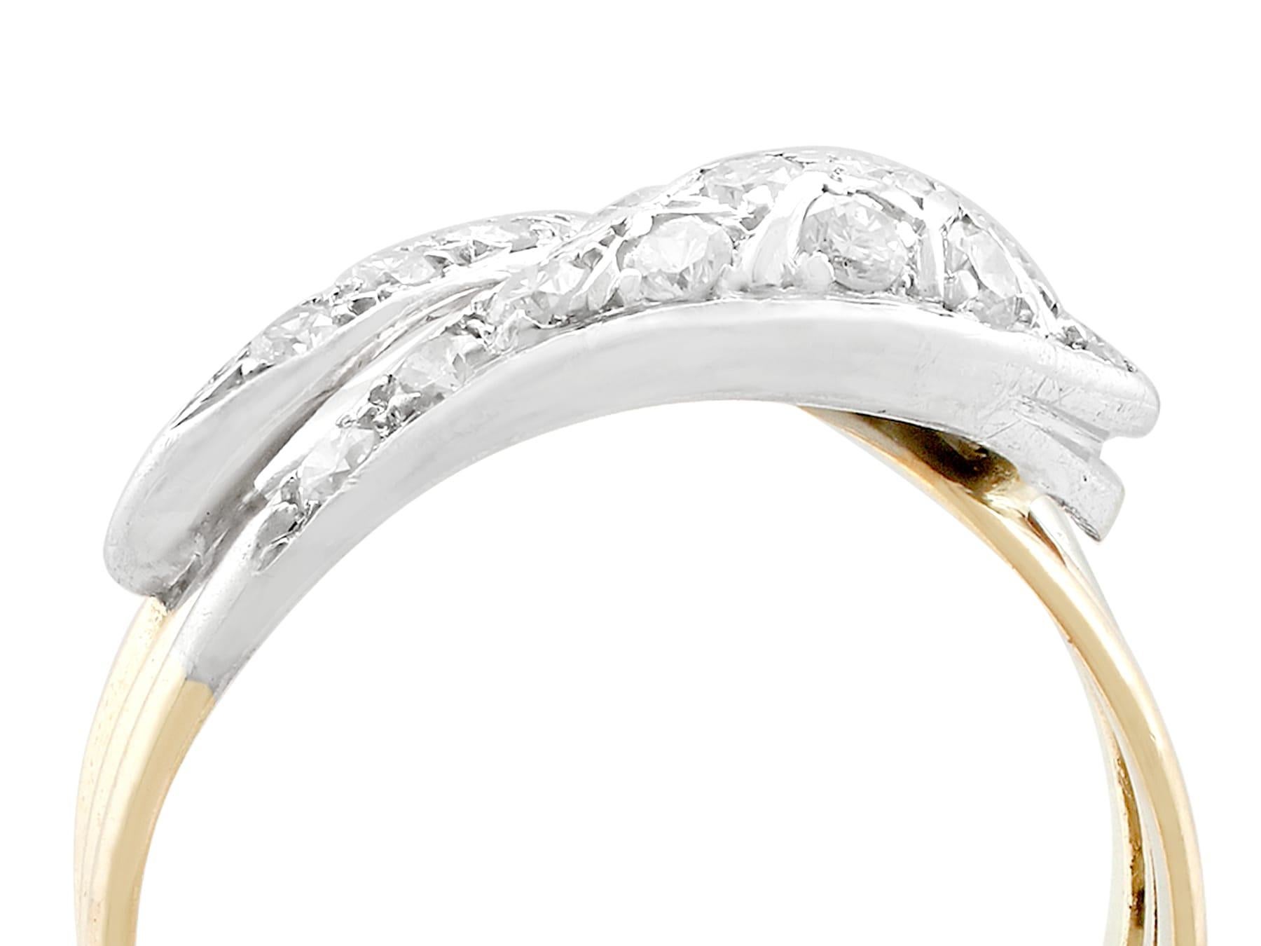 An impressive vintage 0.93 carat diamond and 14 karat yellow gold, 14 karat white gold set 'snake' ring; part of our diverse diamond jewelry and estate jewelry collections.

This fine and impressive diamond snake ring has been crafted in 14k yellow