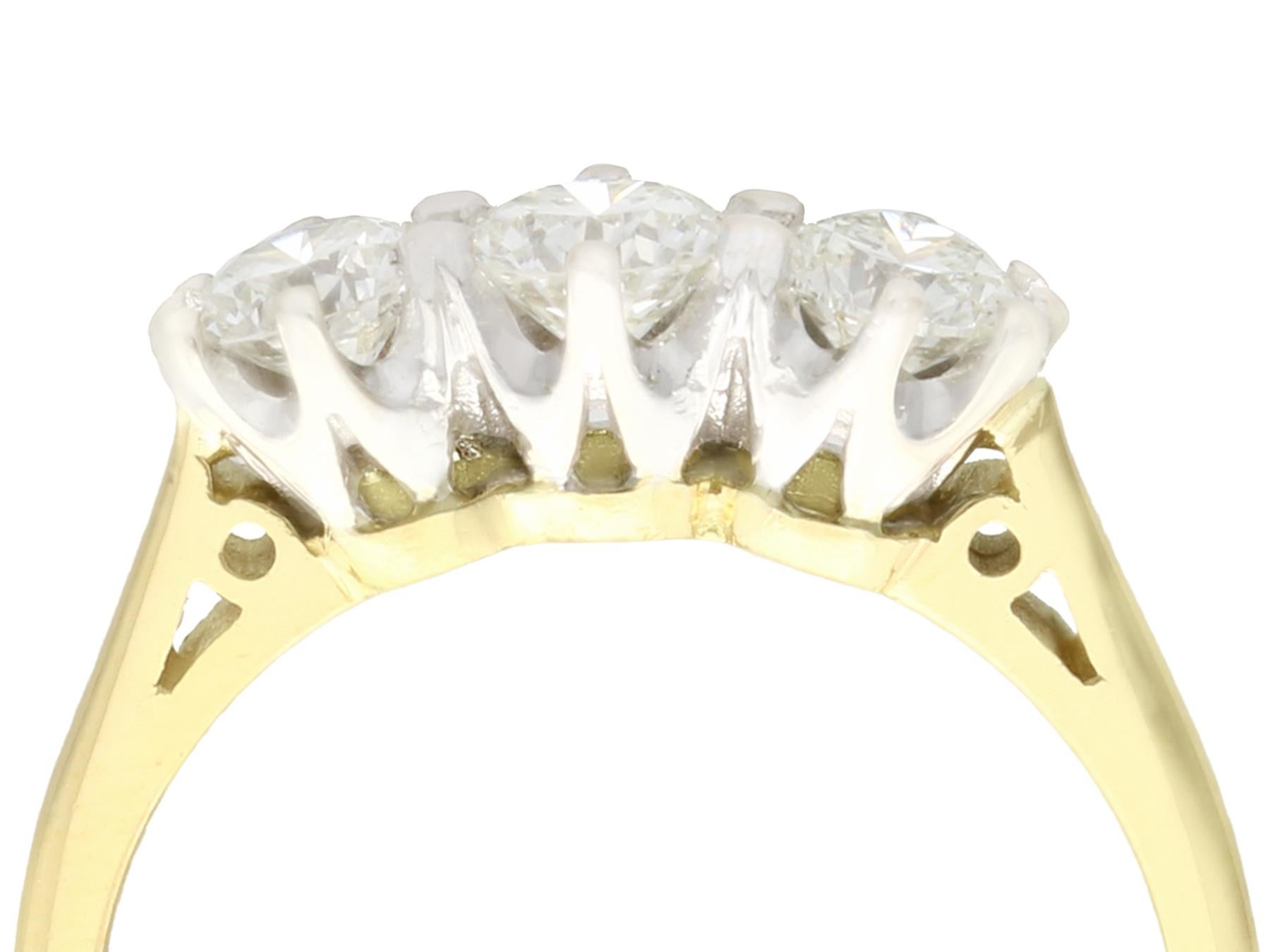 A fine and impressive vintage 0.87 carat diamond and 18 carat yellow gold, 18 karat white gold set trilogy ring; part of our diverse antique jewelry and estate jewelry collections

This fine and impressive vintage trilogy ring has been crafted in