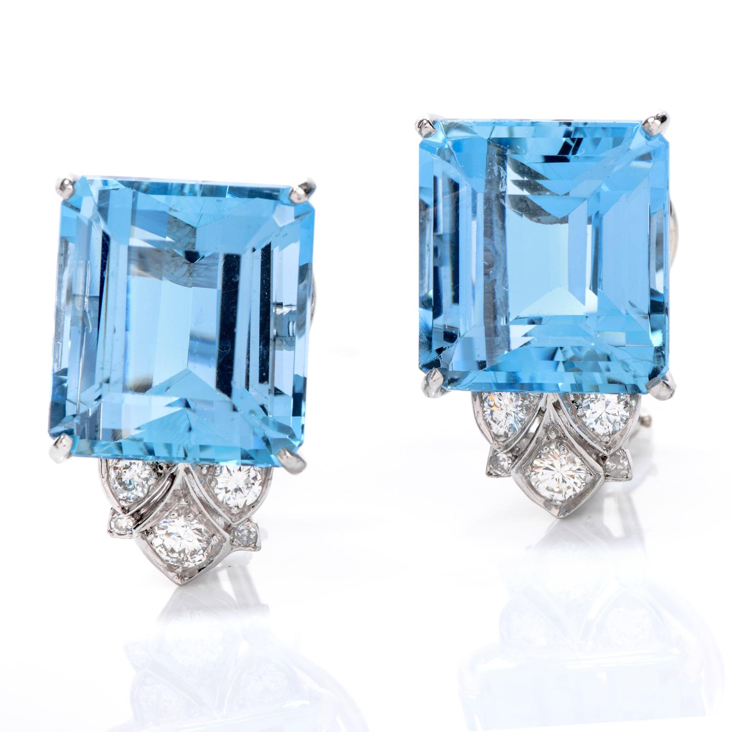 Admire these angelic Diamond Aquamarine & Platinum earrings every day! 

These large emerald-cut Aquamarines are eye-clean and sky blue.  The elegance is evident in its fitting emerald cut and platinum prong setting. 

The aquamarines are crowned