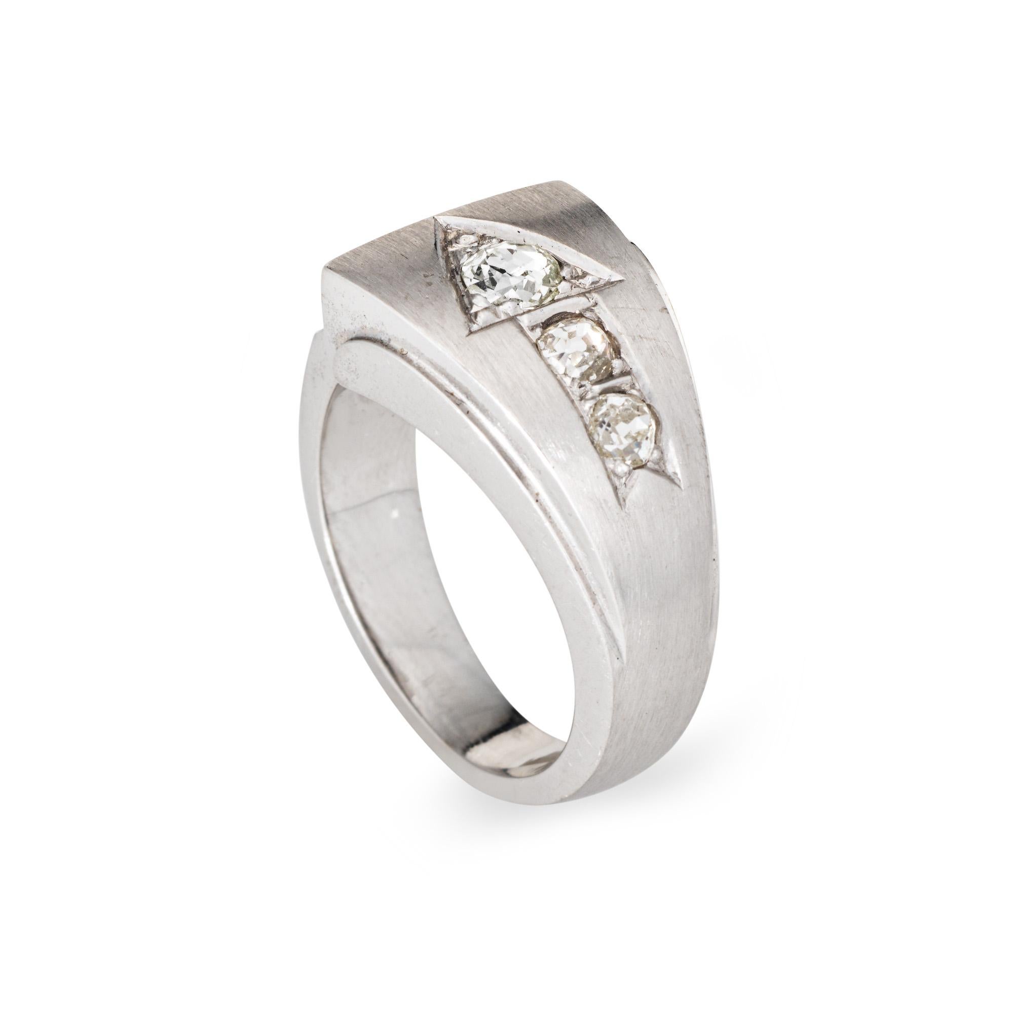 Contemporary diamond arrow ring crafted in 14 karat white gold. 

Old mine cut diamonds total an estimated 0.50 carats (estimated at J-K color and SI1-I1 clarity).

Reclaimed old mine cut diamonds adorn the arrow, set into a contemporary satin