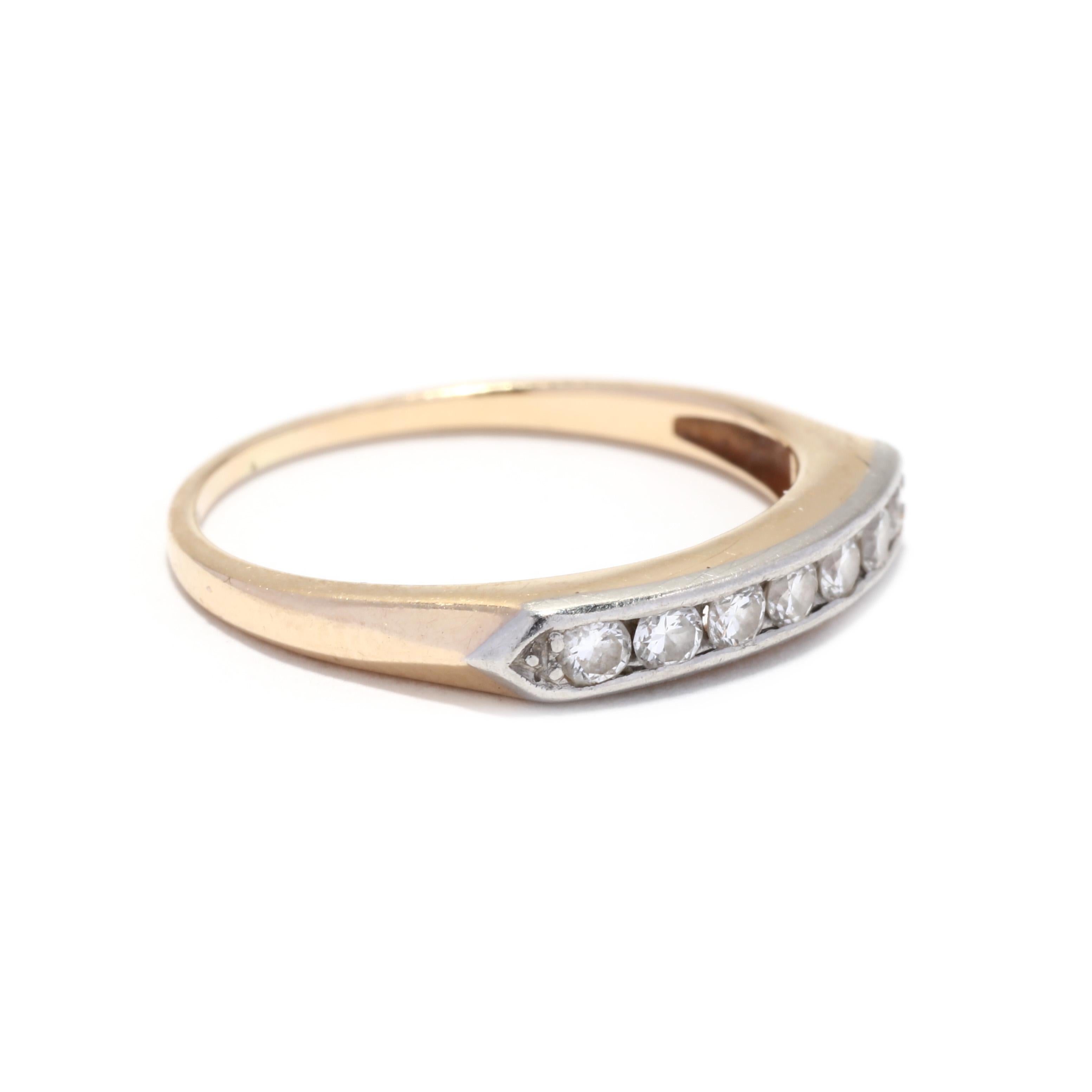 A retro 14 karat yellow and white gold diamond band. This ring features a row of pavé set single cut round diamonds weighing approximately .05 total carats set in white gold and with a tapered yellow gold band.

Stones:
- diamonds, 7 stones
- single
