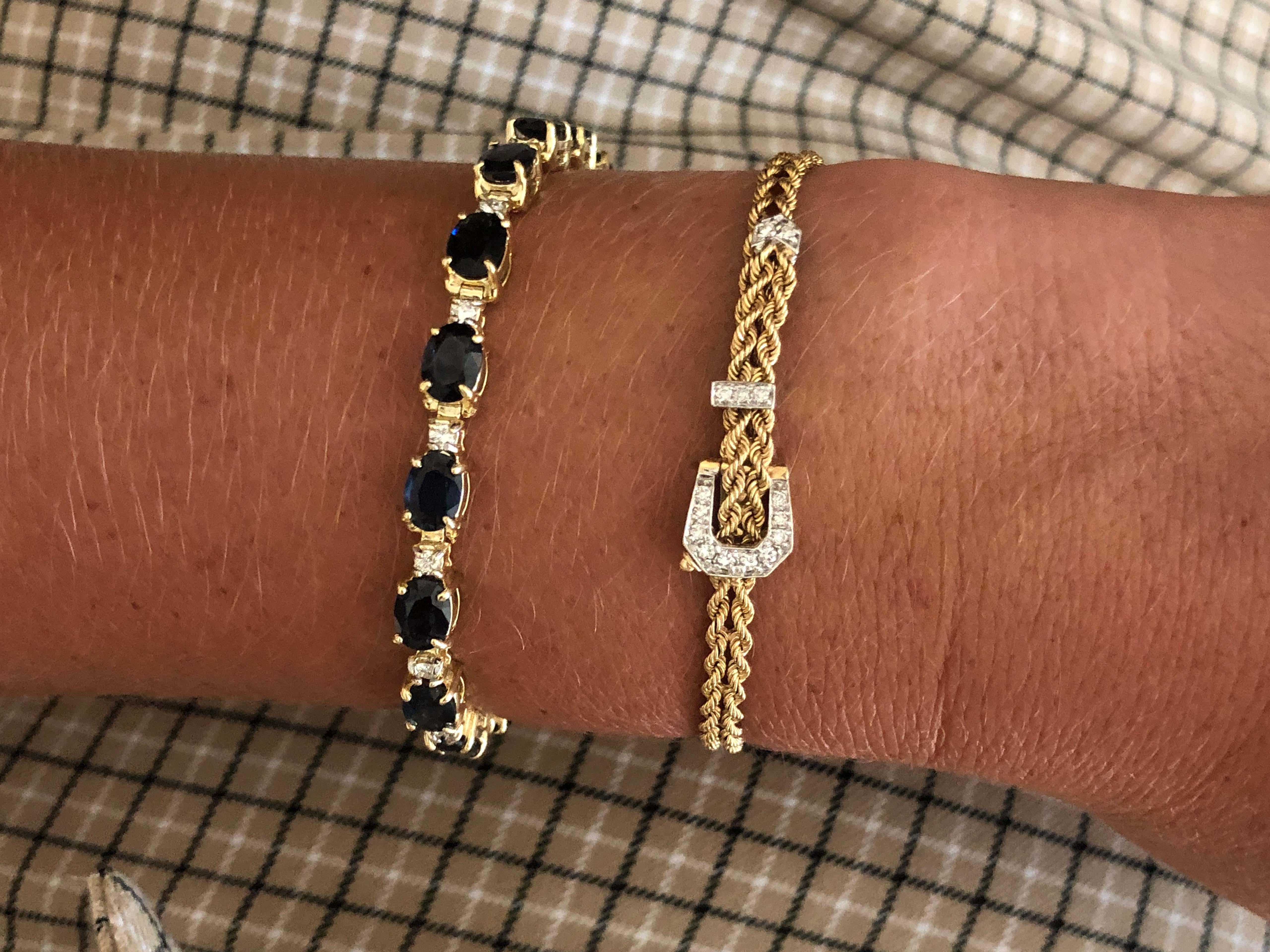 Vintage Diamond Belt Double Rope Bracelet in 14k Yellow Gold. This unique bracelet works just like a belt, tightening by putting the bracelet through the belt buckle. The parts of the buckle are white gold set with a total of 15 diamonds, weighing a