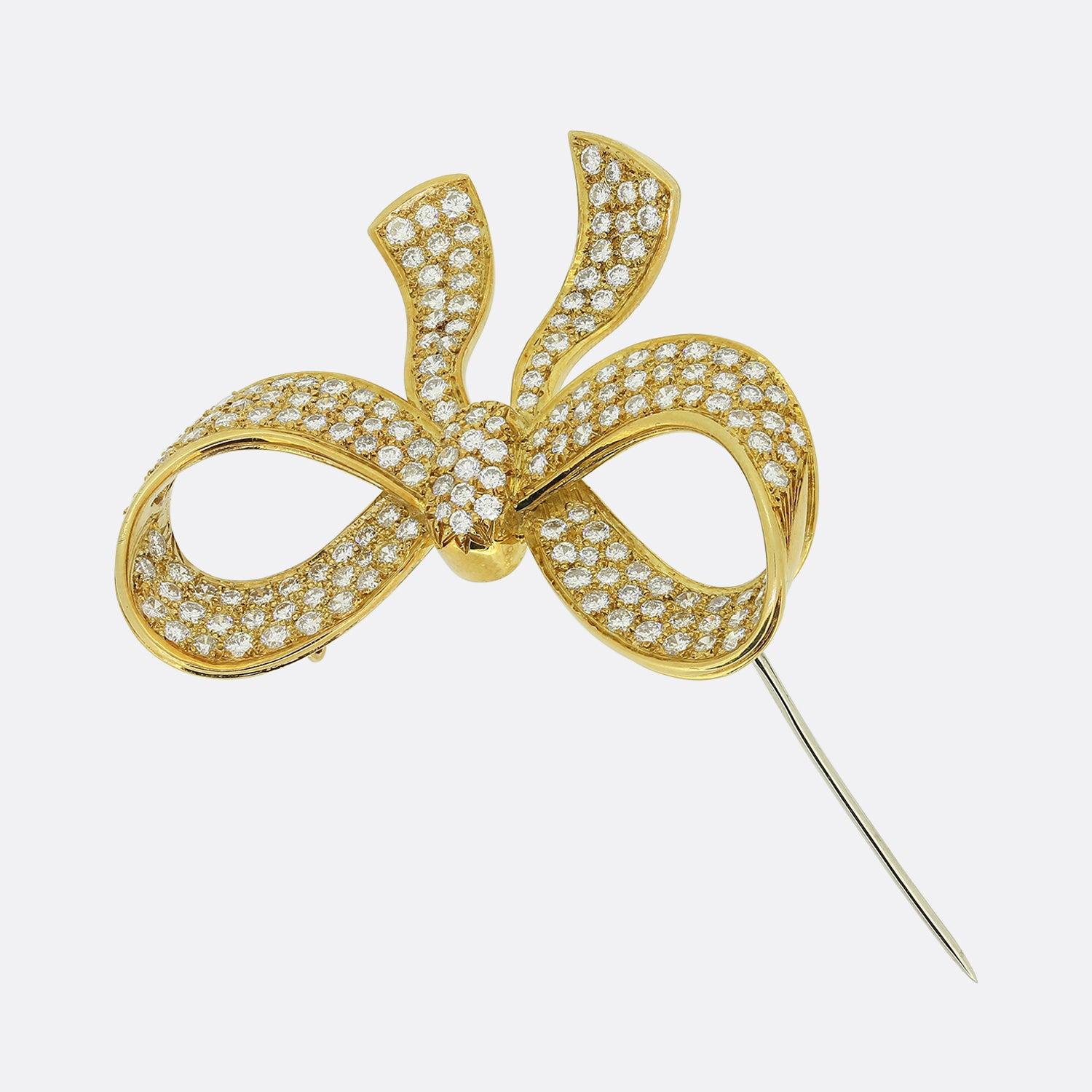 Here we have a truly wonderful vintage diamond bow brooch. The brooch is crafted in 18ct yellow gold and features over 3 carats of exceptional quality diamonds. The diamonds are round brilliant cuts and well matched for colour and clarity.