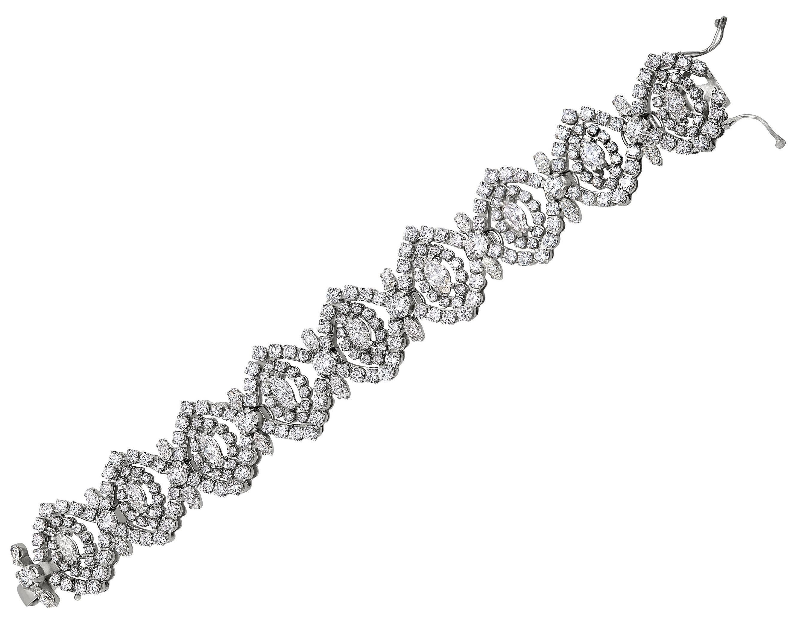 Quite the statement, this vintage diamond bracelet lays beautifully on the wrist. Featuring an integrated clasp with double figure eight safety clasps crafting a beautiful seamless look on the wrist. 

Vintage Diamond Bracelet with Round and Marquis
