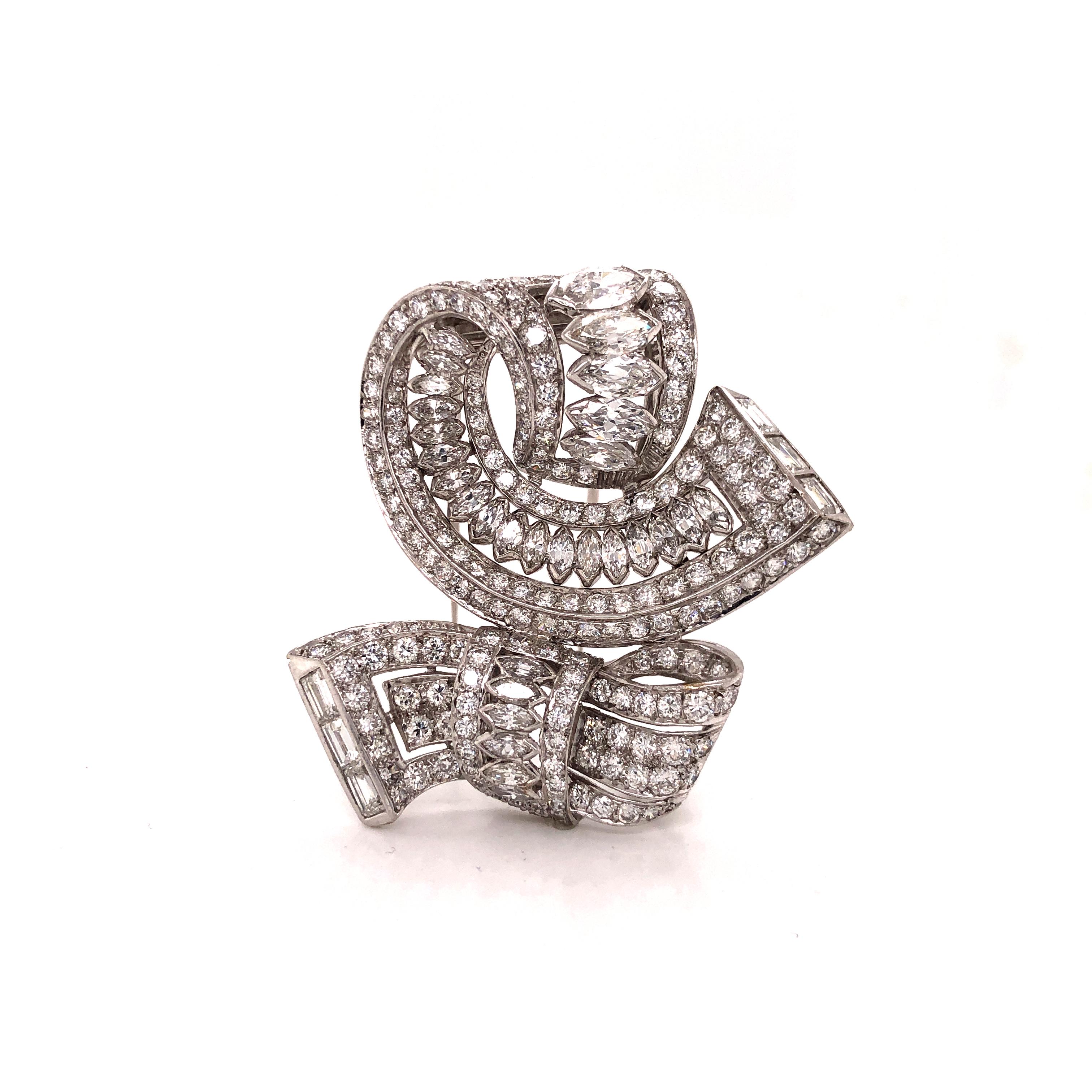 One of a kind diamond brooch crafted in platinum. This brooch is stunning. Swooping sharp angles are seen as this pin was hand crafted by true masters of the time. Art Deco styled this brooch was crafted in the 1940's. Approximately 15.00 carats are