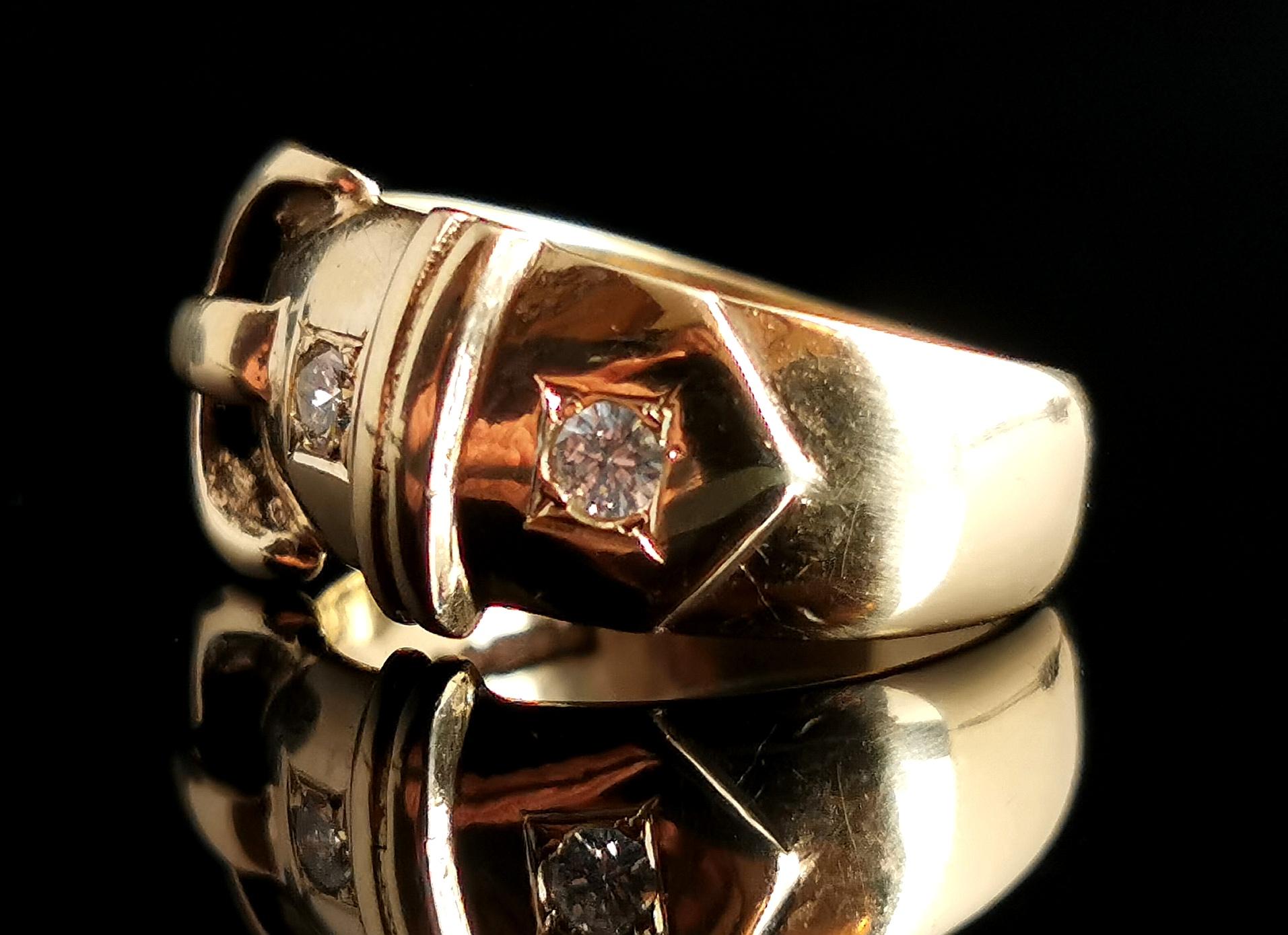 Fall in love with this gorgeous vintage 9kt gold and Diamond buckle ring.

This is an exceptionally well made buckle ring, very high quality with two beautiful brilliant cut diamonds giving plenty of sparkle.

The ring is designed as a belt and