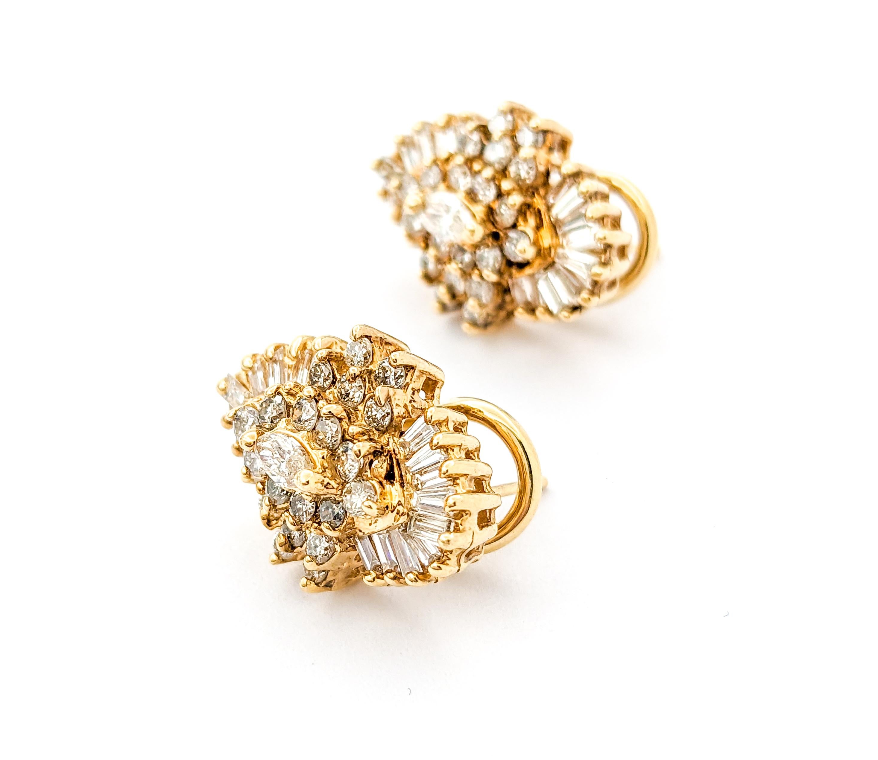 Vintage Diamond Cluster Earrings In Yellow Gold

Discover the allure of these exquisite earrings, meticulously crafted in 14kt yellow gold. These stunning pieces showcase a total of 2.08ctw diamonds, combining both baguette and round brilliant-cut