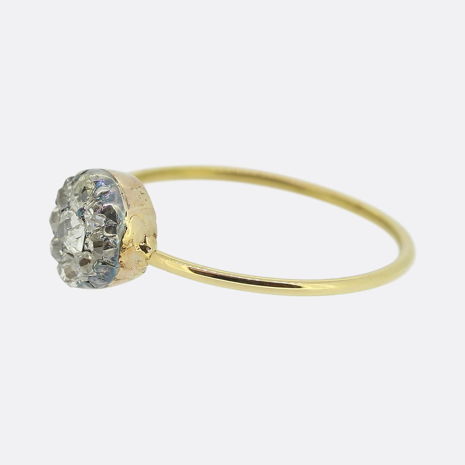 Here we a delightful diamond cluster ring. The piece originally dates back to the Victorian period and showcases a chunky old cushion cut diamond at the centre of the face surrounded by a circulating array of slightly smaller matching stones. All