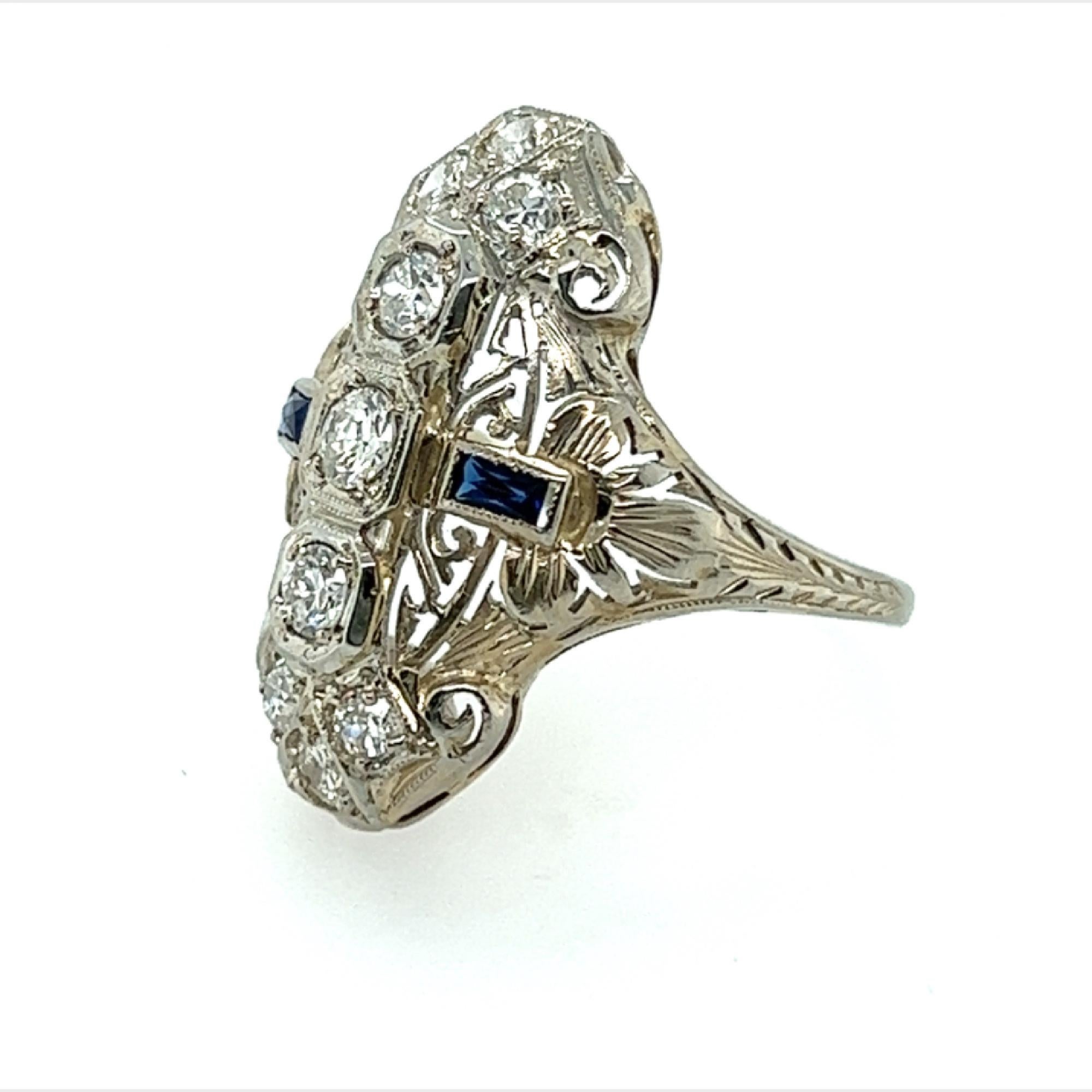 Vintage Diamond Cocktail Ring 1.05ct Transitional Cut & Sapphires 18K Art Deco 


     *Diamond Specifications:
     *Shape: Transitional Old European, Round Brilliant Cut
     *Total Carat Weight: .90 Carat
     *Color: F - G 
     *Clarity: VS2
  