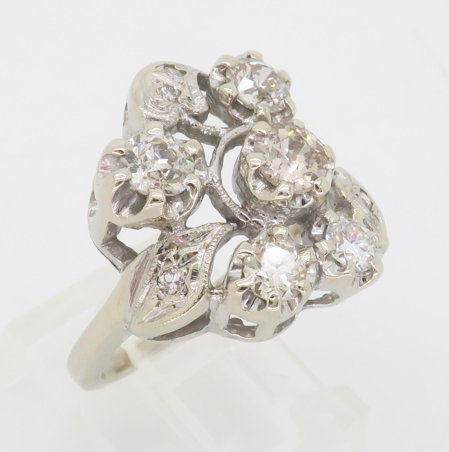 Vintage diamond cocktail ring with 1.00ctw of diamonds set into a beautiful design.

Diamond Carat Weight: Approximately 1.00CT
Diamond Cut: Old European Cut
Diamond Color: Average I-K
Diamond Clarity: Average SI2-I1
Metal: 14k White Gold
Stamped: