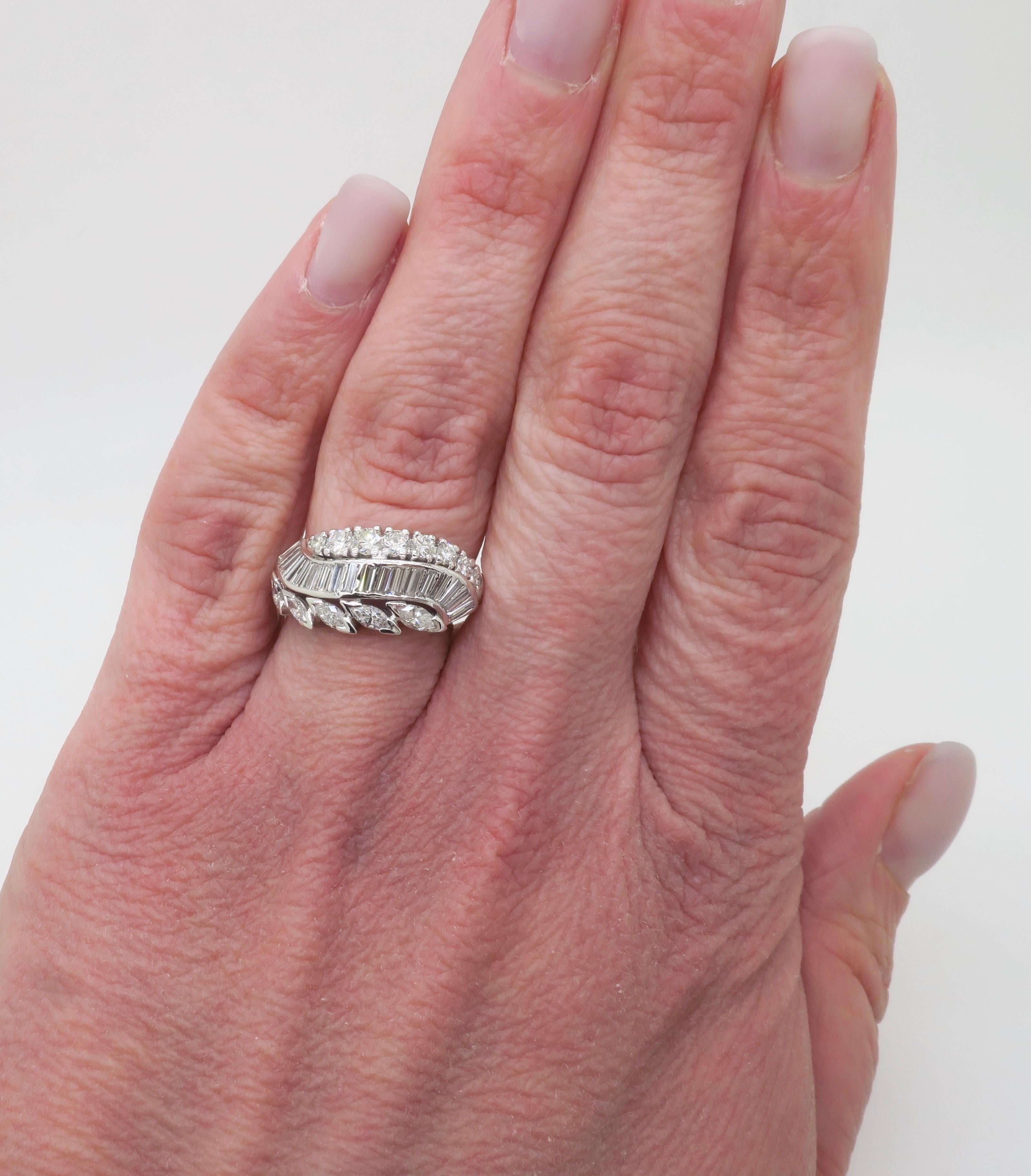Round Cut Vintage Diamond Cocktail Ring featuring Round, Baguette, and Marquise Diamonds For Sale
