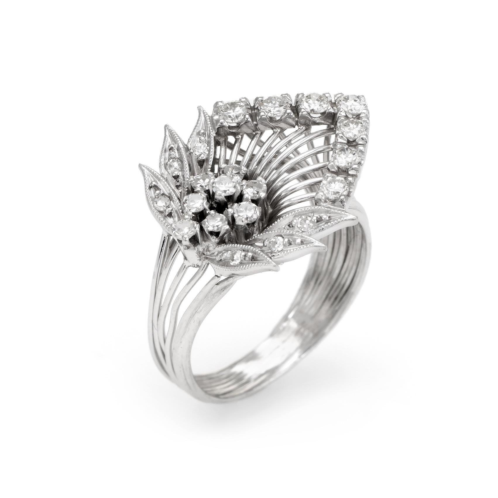 Finely detailed vintage diamond cocktail ring (circa 1950s to 1960s), crafted in 900 platinum. 

Round brilliant and single cut diamonds graduate in size from 0.01 to 0.04 carats, totaling an estimated 0.58 cartas (estimated at H-I color and VS2-SI1