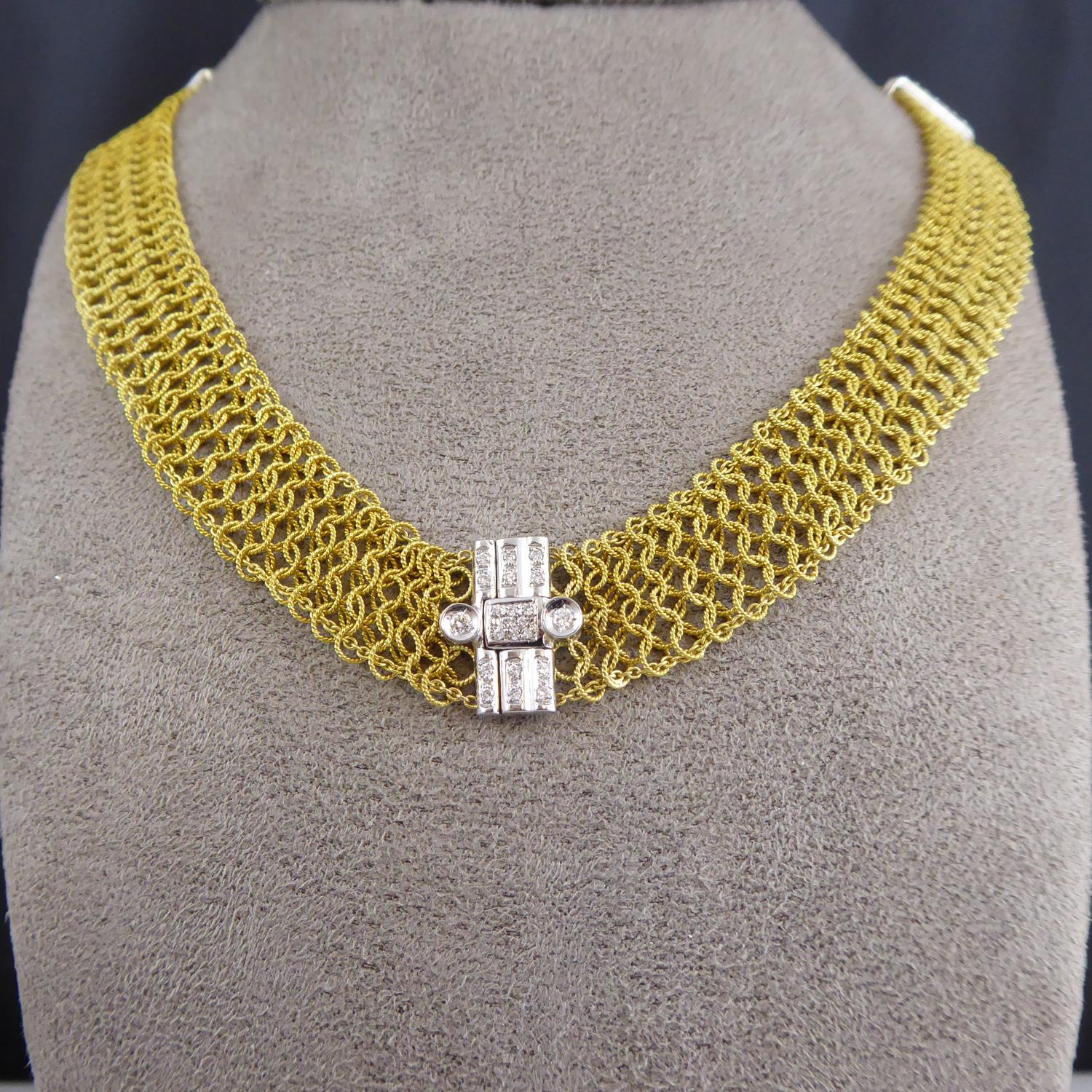 A beautiful vintage gold and and diamond collar style necklace in a contemporary designer style.  The necklace is comprised of small, twisted gold wire circles that have been 