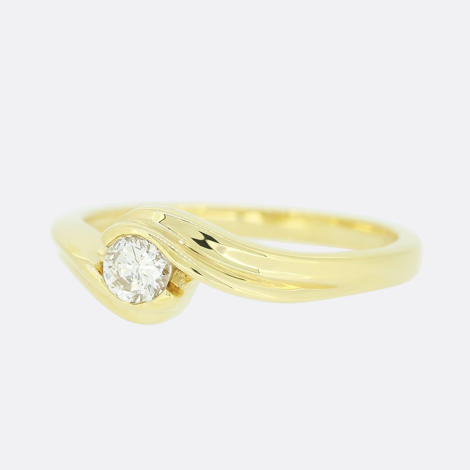 This is an 18ct yellow gold diamond ring. The ring plays host to a central diamond in a crossover setting.

Condition: Used (Excellent)
Weight: 6.8 grams
Size: U
Face Dimensions: 6mm x 6mm
Total Diamond Carat Weight: Approx. 0.20 carats
Diamond