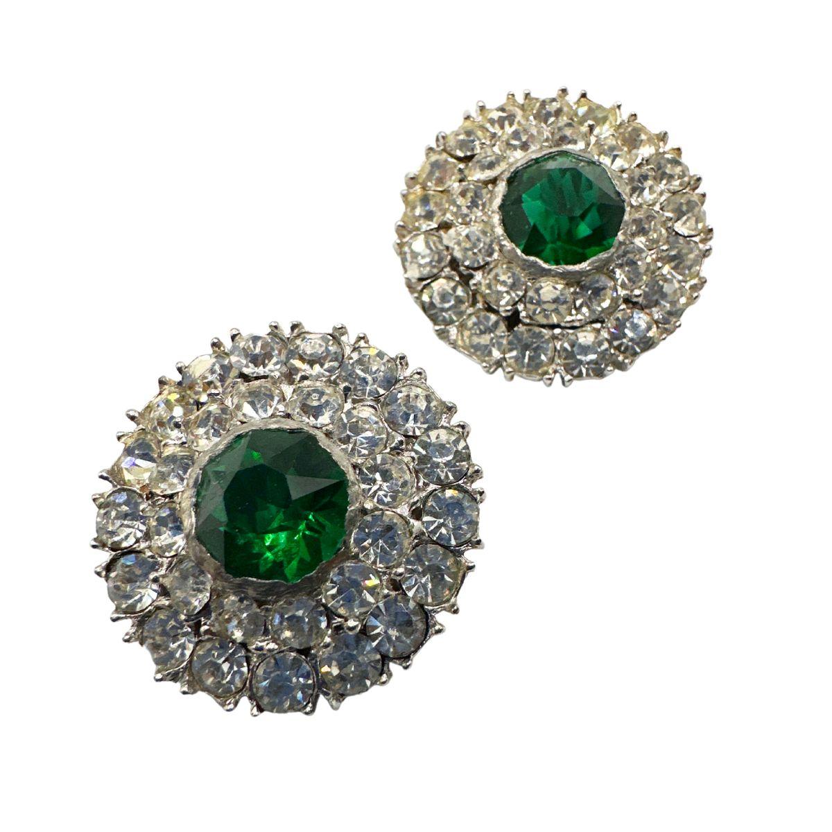 Earring Diameter: 1.16″

Bin Code: E12 / P2

Description: Elevate your style with these exquisite Vintage Diamond Cut Green Glass and Rhinestone Earrings. Crafted with meticulous attention to detail, these earrings exude vintage charm and capture