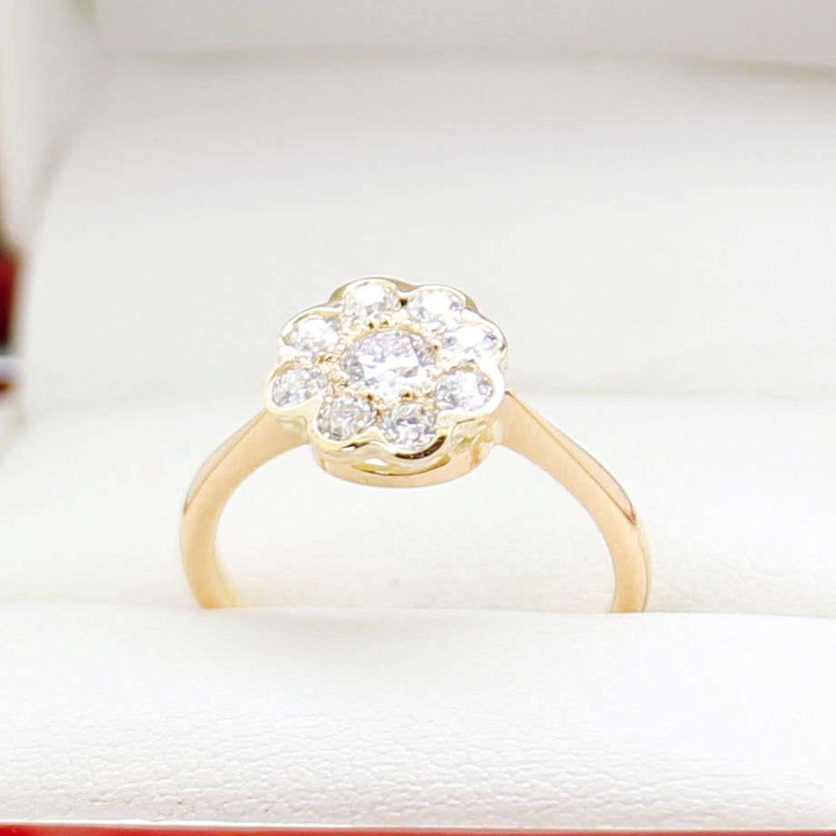 Claw and Rub over with halo setting 14ct yellow gold ring, narrow, high half-round, reverse tapered shank with open back, polished finish.

The item contains:

One claw and rub over set natural early Brilliant Cut Diamond, clarity is 