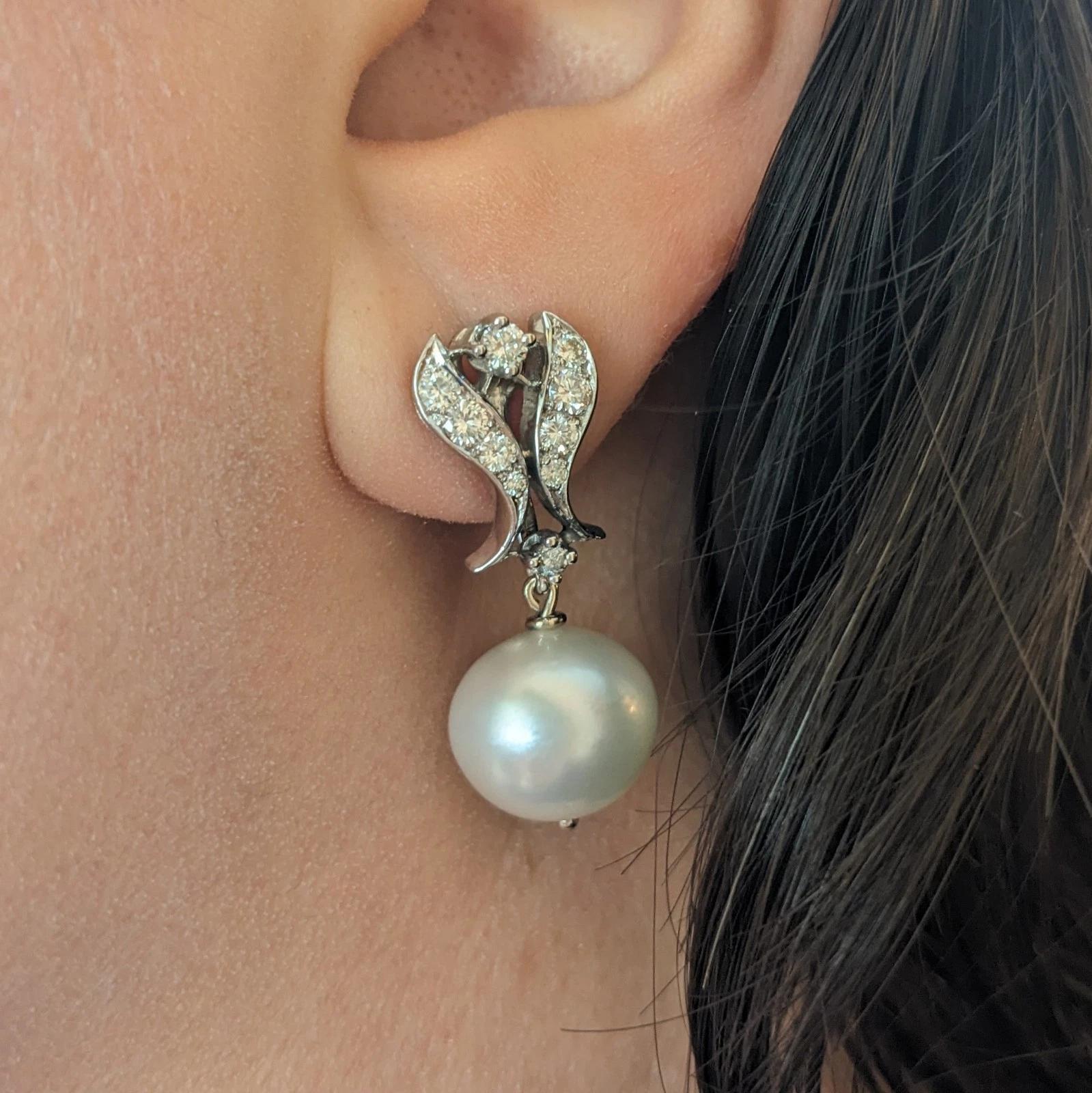 Vintage Diamond Dangle Earrings with Pearl Drop in 14k White Gold 

Vintage Diamond and Pearl Earrings features Round Brilliant Diamonds set in 14k White Gold with a South Sea Pearl drop. The white pearls can be detached; the earrings are secured by