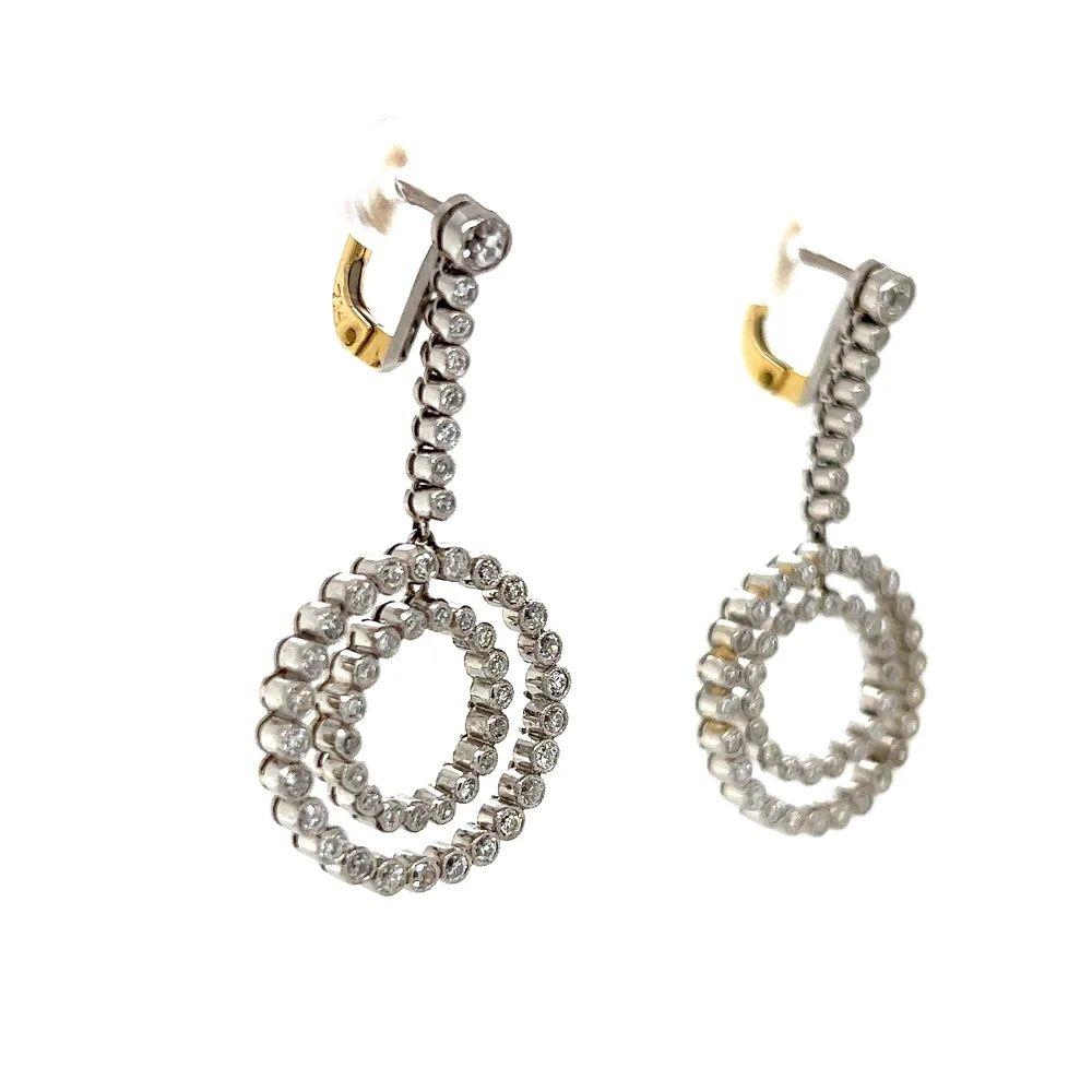 Simply Beautiful! Finely Detailed Vintage Double Circle Diamond Drop Earrings. Hand crafted in Platinum and Hand set with round diamonds, weighing approx. 3.00tcw. The earrings are in excellent condition and were recently professionally cleaned and