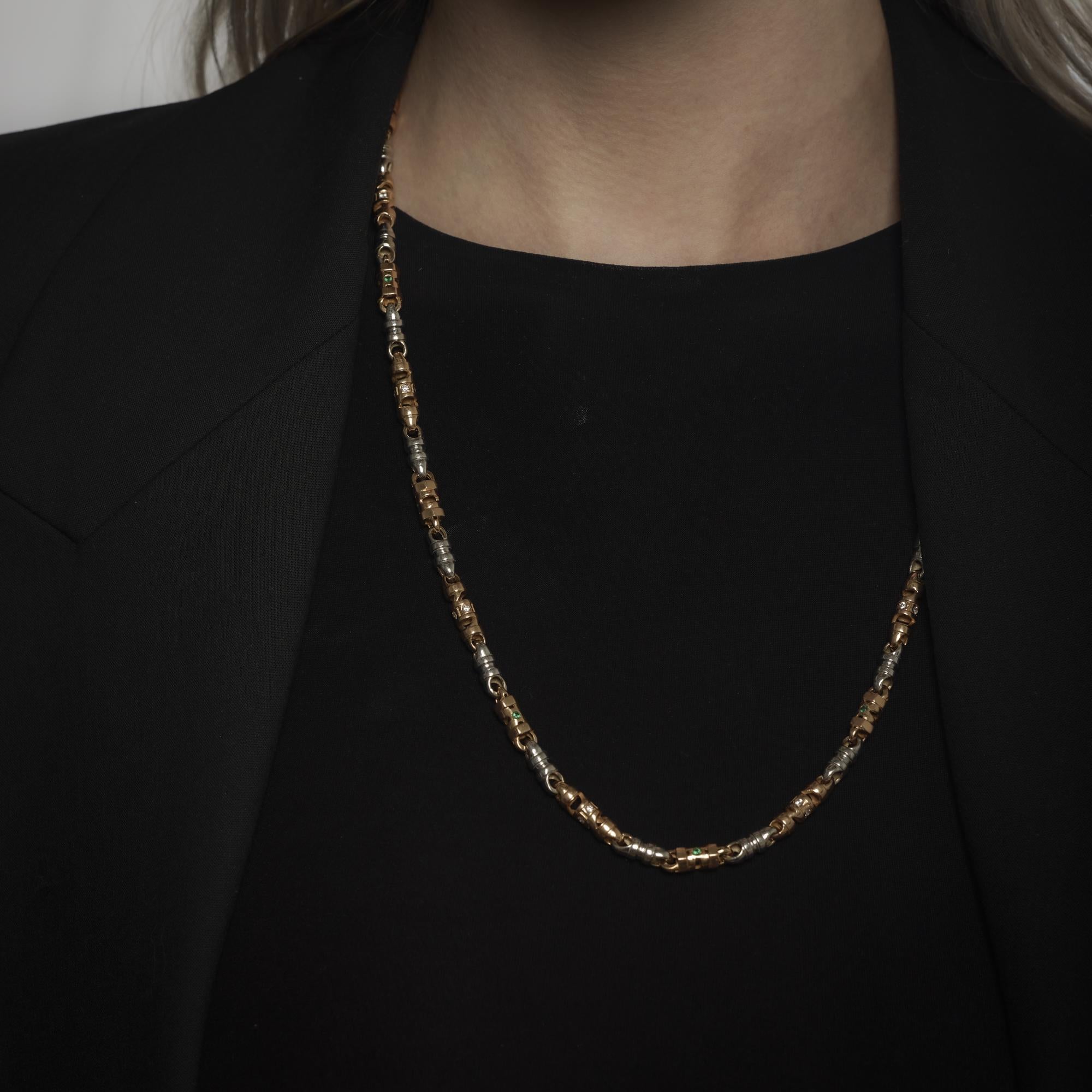 This vintage 1980’s necklace shimmers with forty-four round brilliant cut diamonds, totaling approximately .65 carats in G-H color and SI clarity, paired with twenty-two round cut emeralds totaling approximately .30 carats. The luminous diamonds and
