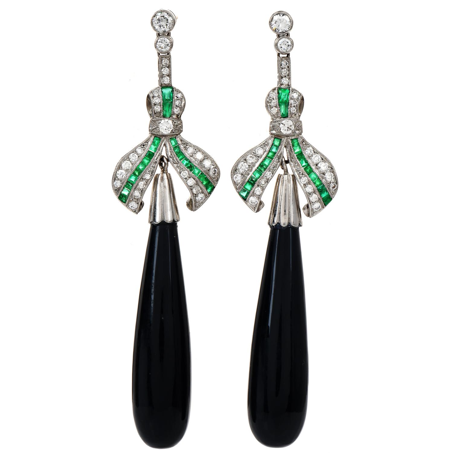 Enjoy these exquisite, elegant, and unique ribbon-inspired dangle drop earrings!

These dramatic earrings are wonderfully styled for a special event.

Finely crafted in Platinum, they have 2 genuine black onyx, cabochon pear shaped measuring 35 mm x