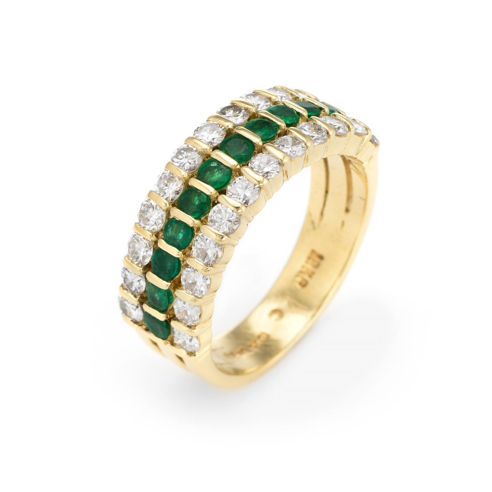 Finely detailed vintage emerald & diamond band, crafted in 18 karat yellow gold. 

24 full cut diamonds are estimated at 0.05 carats each, totaling an estimated 1.20 carats (estimated at H-I color and SI1-2 clarity). The 12 emeralds are each