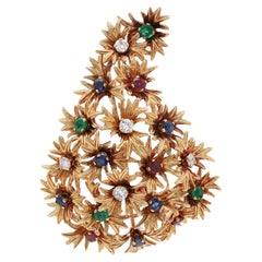 Blumenbrosche aus 18 Karat Gelbgold mit Diamant, Smaragd, Saphir und Rubin
