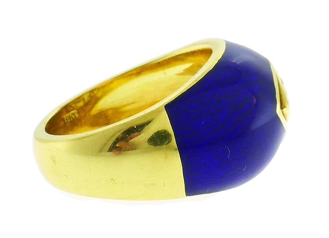 Colorful ring made of 18 karat yellow gold, cobalt blue enamel and featuring a 0.72-carat marquise cut diamond, J-K/VS1.
Measurements: 7/8 x 1/2 inch (2 x 1.2 cm). 
Ring size 5.5. 
Weight 9.3 grams. 
Stamped with a hallmark for 18 karat gold and