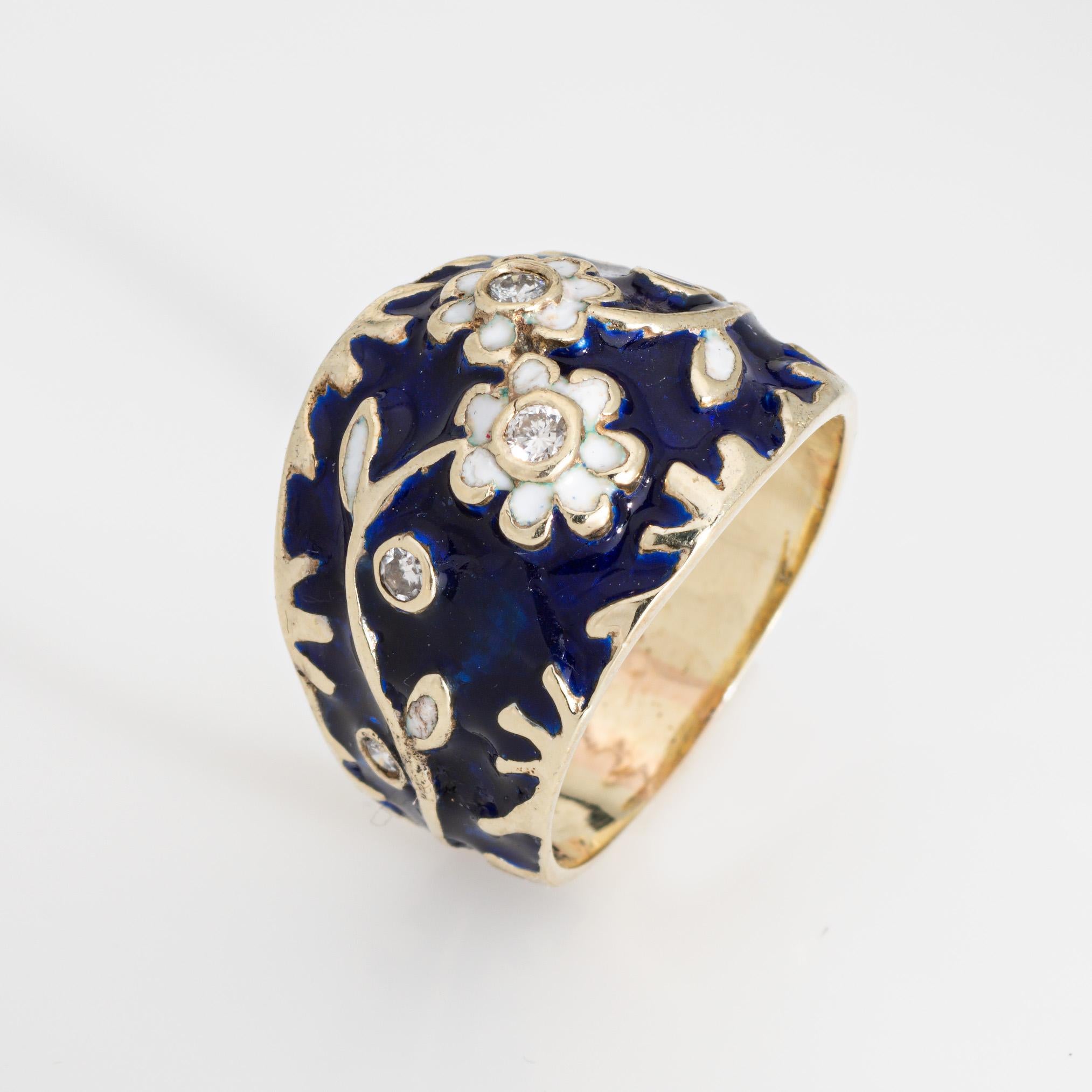 Stylish diamond enamel flower ring crafted in 10 karat yellow gold (circa 1960s to 1970s).

Six diamonds total an estimated 0.05 carats (estimated at H-I color and SI1-I1 clarity).

Navy blue enamel serves as the backdrop to a beautiful diamond set