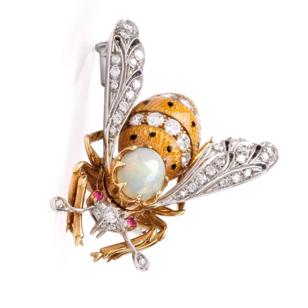 Vintage bee brooch pin in 18-karat yellow gold and platinum with black red ruby eyes and opal head. Its wings made of solid platinum.  This vintage pin is covered with approx. 37 round brilliant cut diamonds total 1.60 carats and are G-H color and