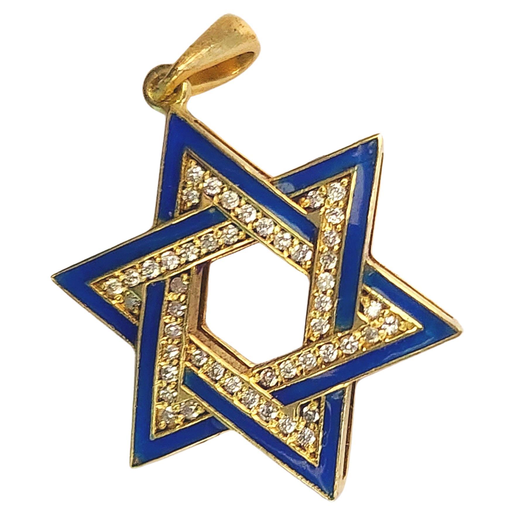 A glistening megan david also known as the star of david vintage 14k gold pendant  with brilliant cut diamonds estimate weight of 0.30 carats decorted with blue enamel 7.50 grams of gold in open work style on the back