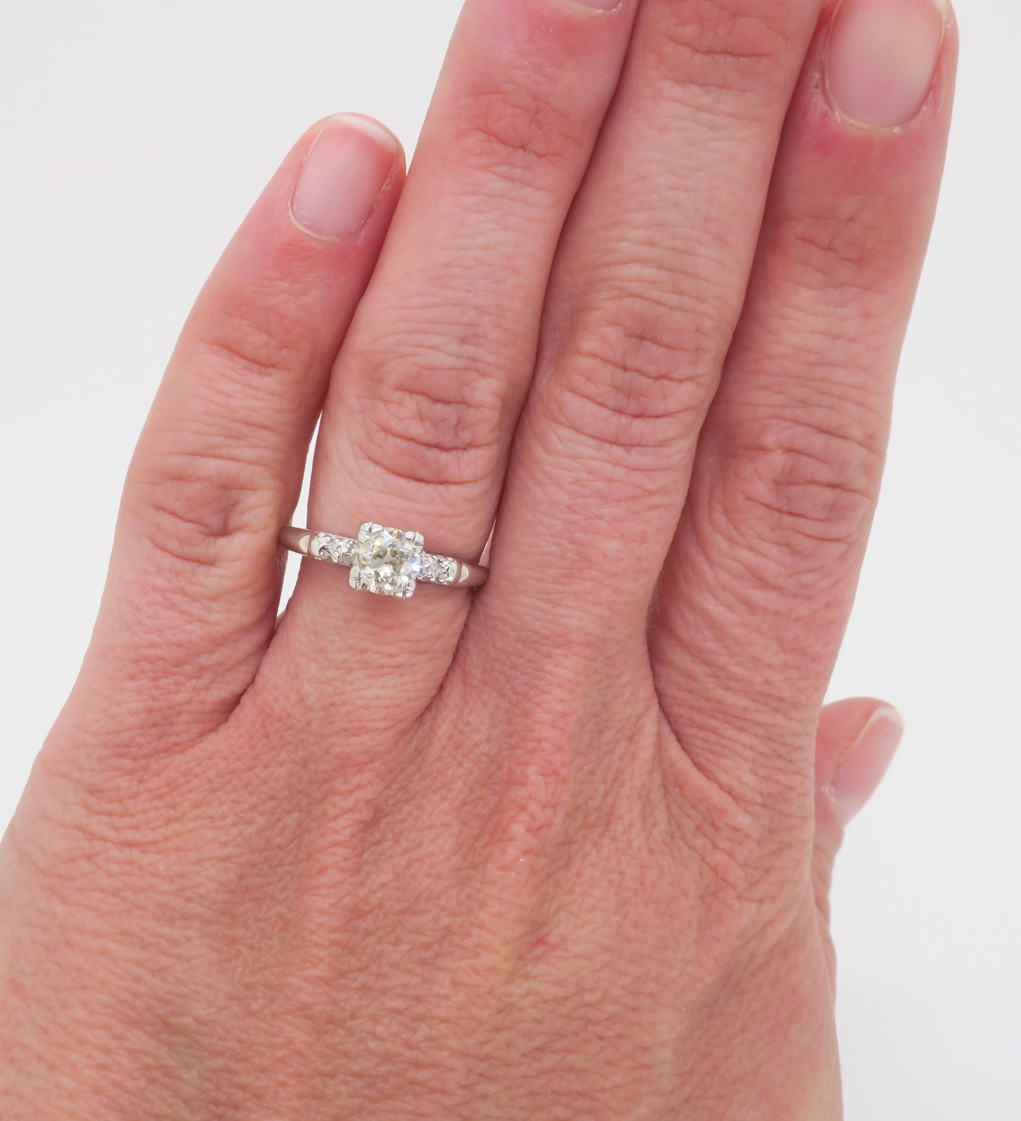 Vintage Diamond Engagement ring featuring an Old Mine Cut Diamond in the center. 

Center Diamond Carat Weight: Approximately .65CT
Center Diamond Cut: Old Mine Cut
Center Diamond Color: J-K
Center Diamond Clarity: I1
Metal: 14k White Gold 
Stamped: