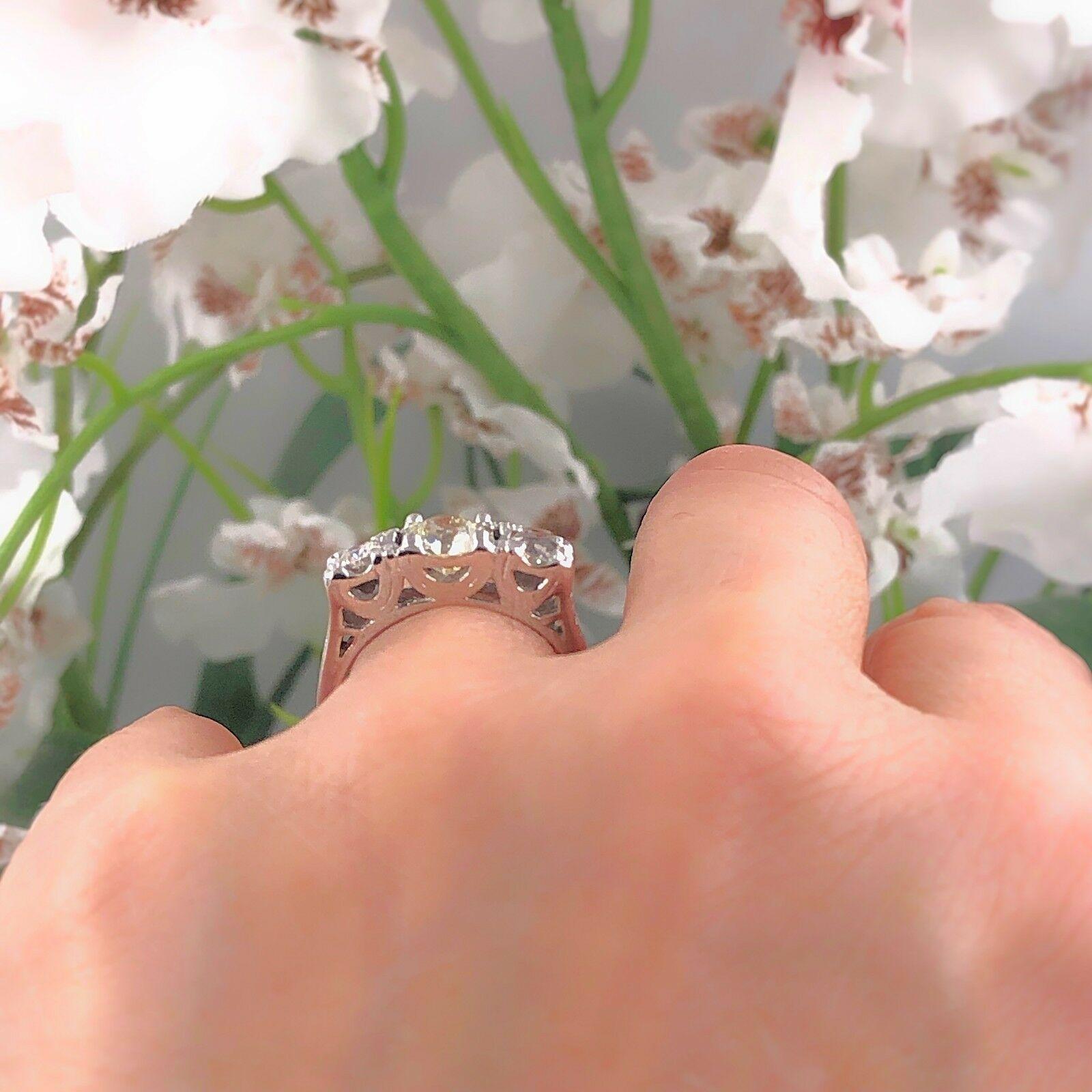 Three-Stone Round Diamond Engagement Ring
Style:  Past Present Future
Metal:  14 KT White Gold
Size:  8 - sizable
Total Carat Weight:  1.53 cts
Diamond Shape: 1.04 cts center, 0.49 Sides stones. 
Diamond Color & Clarity: K-L VS  
Hallmark: 