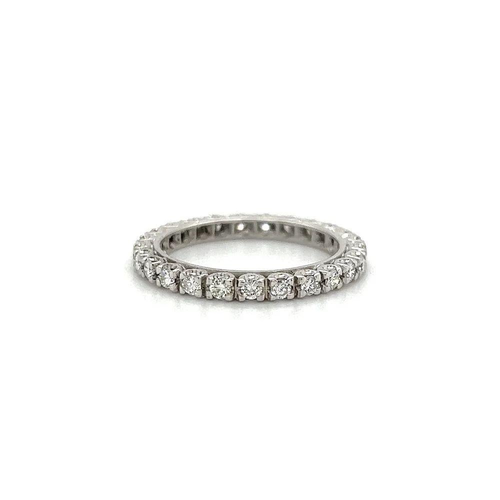 Simply Beautiful! Finely detailed 2.5mm Eternity Platinum Band Ring. Hand set with 25 Round Brilliant-Cut Diamonds, weighing approx.0.90tcw. Hand crafted 18K White Gold mounting. Ideal worn alone or as an alternative Engagement ring or Wedding band.