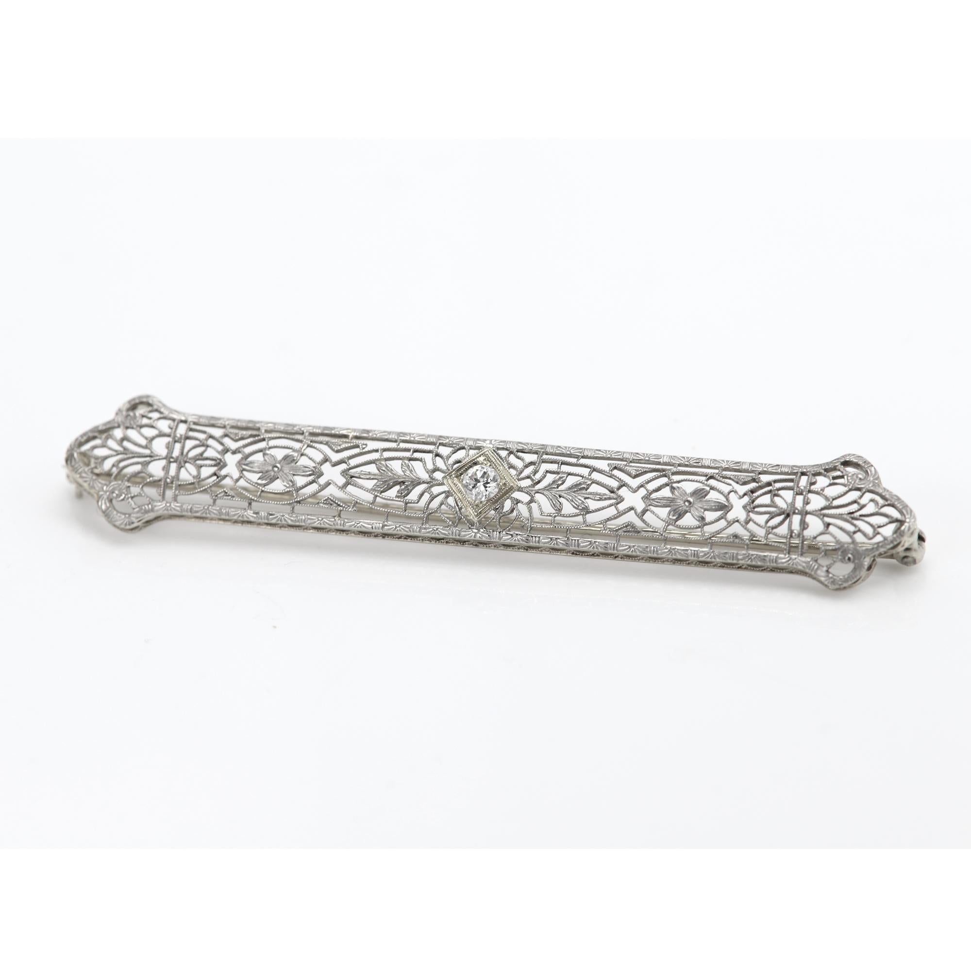 Vintage Brooch pin 
14k Gold with one natural Diamond approx 0.14ct /3.2mm H-VS
Circa 1940's pre-owned - very Good condition
White Gold approx 4.40 grams
Length Size 2.75' inch (or 70mm)
Width size: 8mm
Was bought at a Connecticut estate