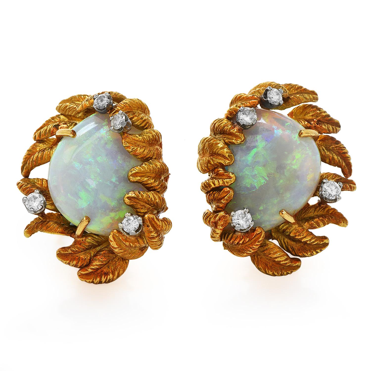 Compliment your Opal jewelry collection by adding these fiery opal earrings.

These eye-catching retro vintage earrings are crafted in solid 18k yellow gold with a leaf motif textured finish, weigh 14.7 grams, and measure 25 mm x 20 mm.

Exposing a