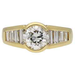 Vintage diamond flanked solitaire ring, French, circa 1970.