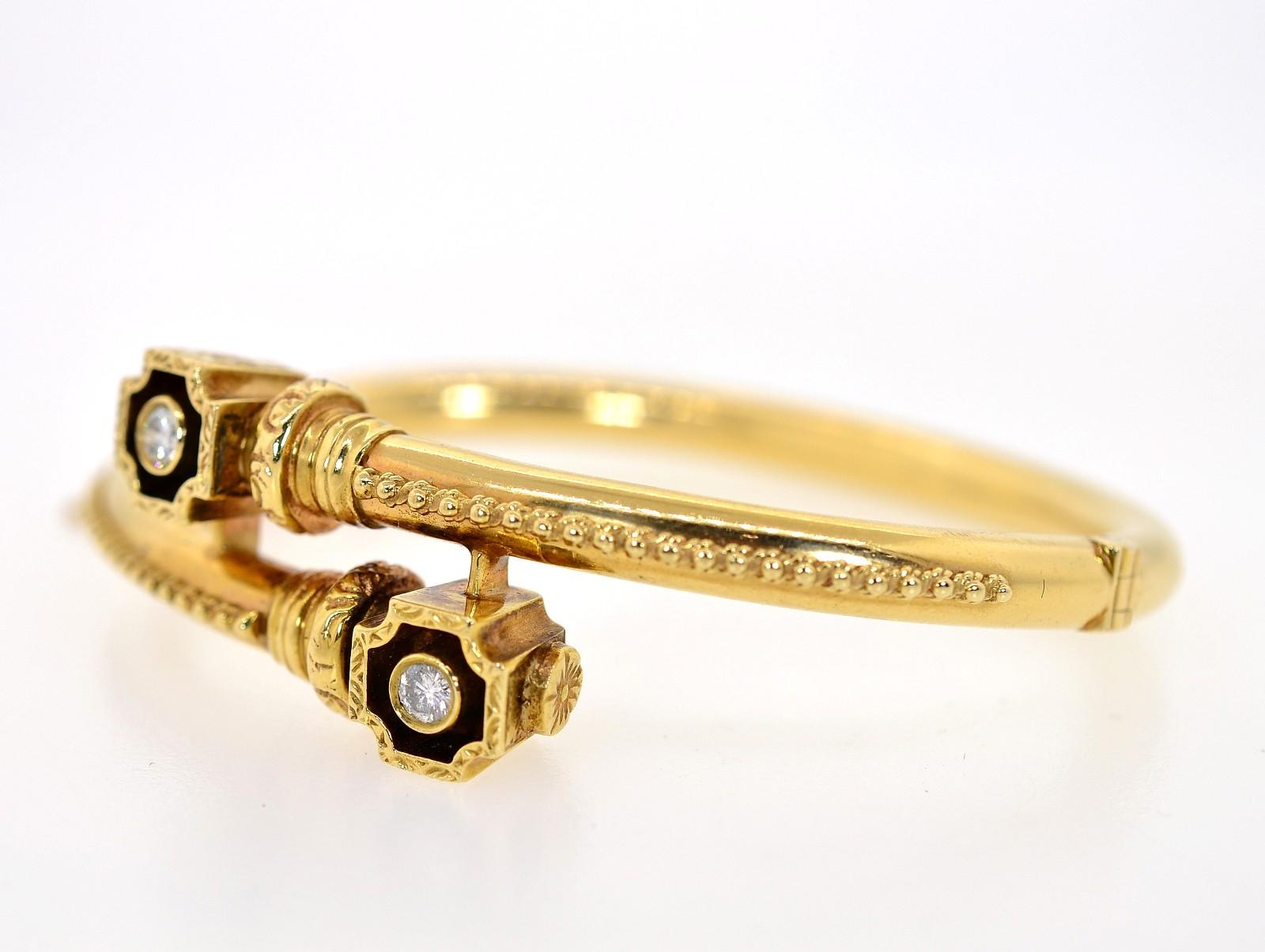Created of 14KT yellow gold in the 1960s, this attractive bangle is of a bypass design.  Flaunting two sparkly Round Diamonds encased on an octagonal square frame beautifully engraved.  This pretty bangle is enhanced with a ball rope design down