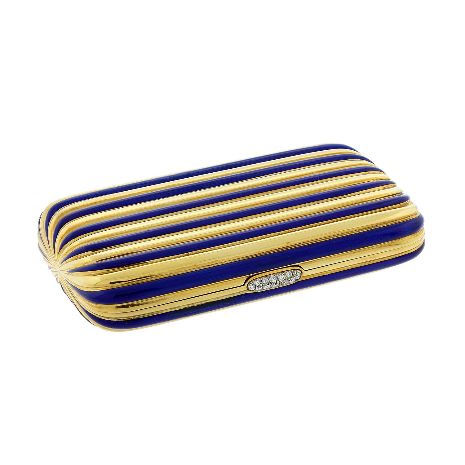 This exceptional compact features a striped design in 18K yellow gold and vibrant blue enamel. The case opens with a press on the diamond clasp.  Inside features a clean yellow gold striped design.  As a multi-use case it can be used to hold cards,
