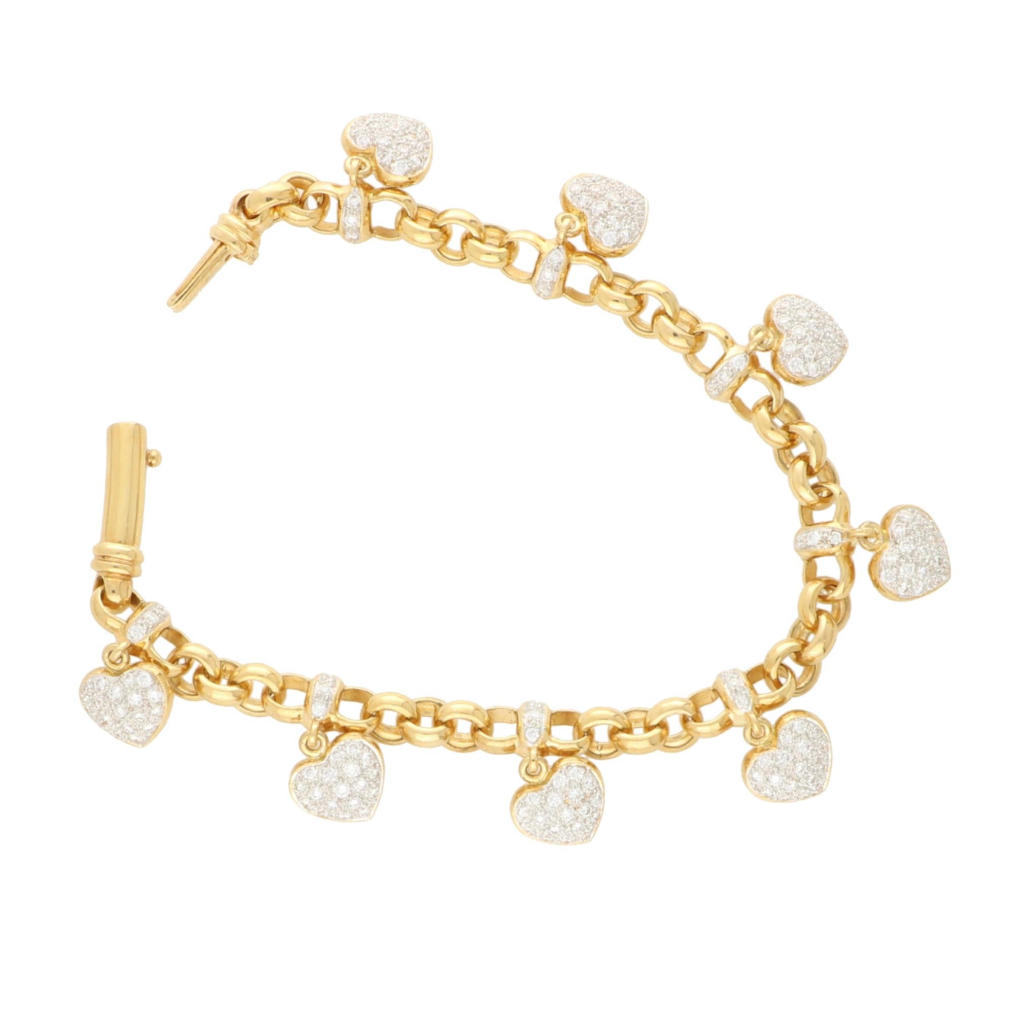 A beautiful vintage diamond heart bracelet set in 18k rose gold. 

The bracelet is composed of chunky open rose gold links set with diamonds set terminals. From each terminal, hangs a white and rose gold heart, pave set with round brilliant cut
