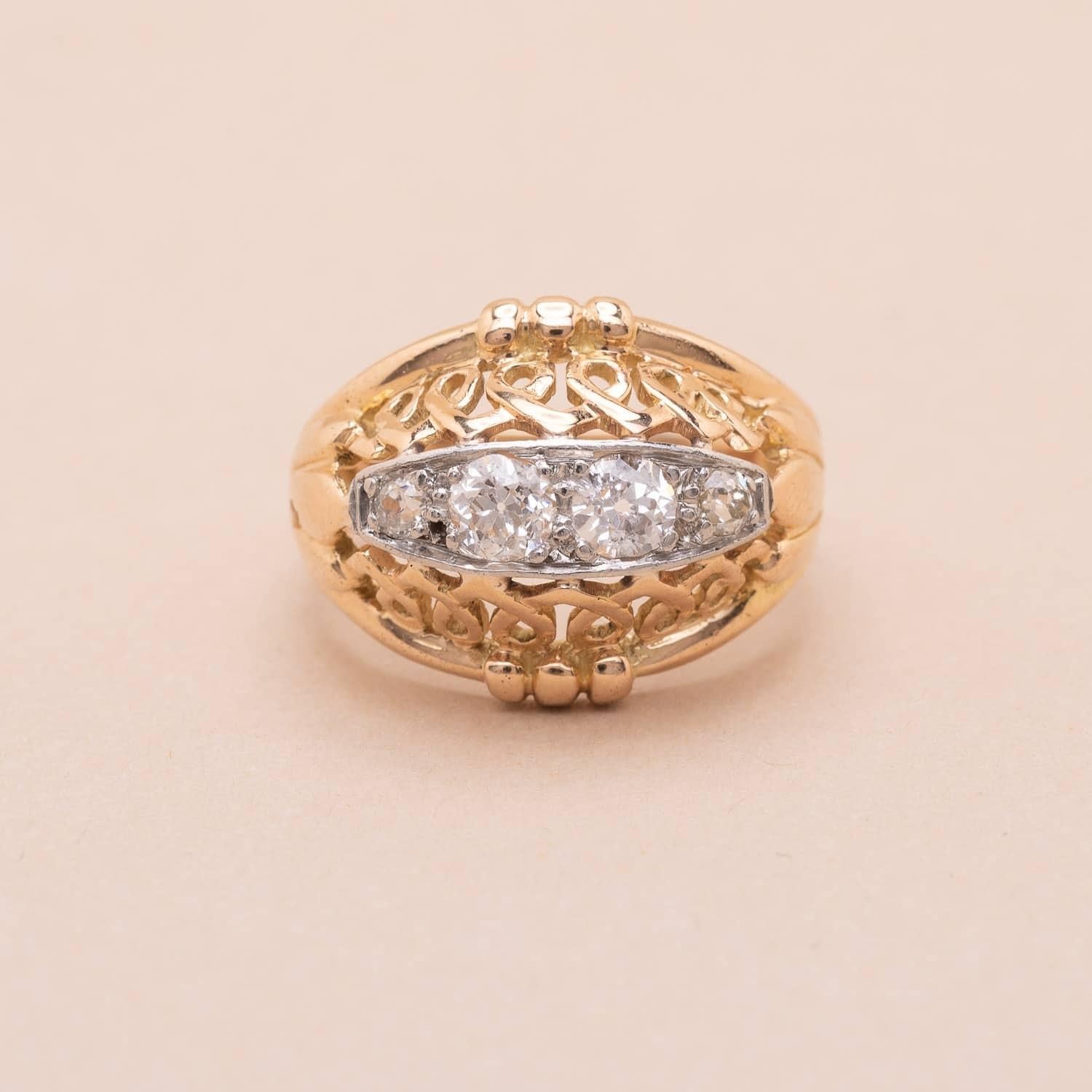 Vintage 18K (750°/00) gold and platinum (950°/00) set with 3 round old-cut diamonds. This gorgeous ring is jarretière inspired, a classic and elegant shape typical of the 40s French jewelry. 

Total diamond weight : 0.40 carats

Color : IJ / Purity