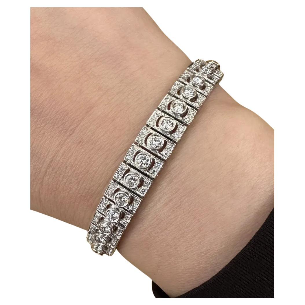 Vintage Diamond Link Bracelet 6.00 Carats Total Weight in Platinum 

Vintage Diamond Bracelet features 39 Rectangular Links each containing 1 Round Brilliant Diamond Bezel set in the center and 4 smaller Round Diamonds set in Platinum. Bracelet is