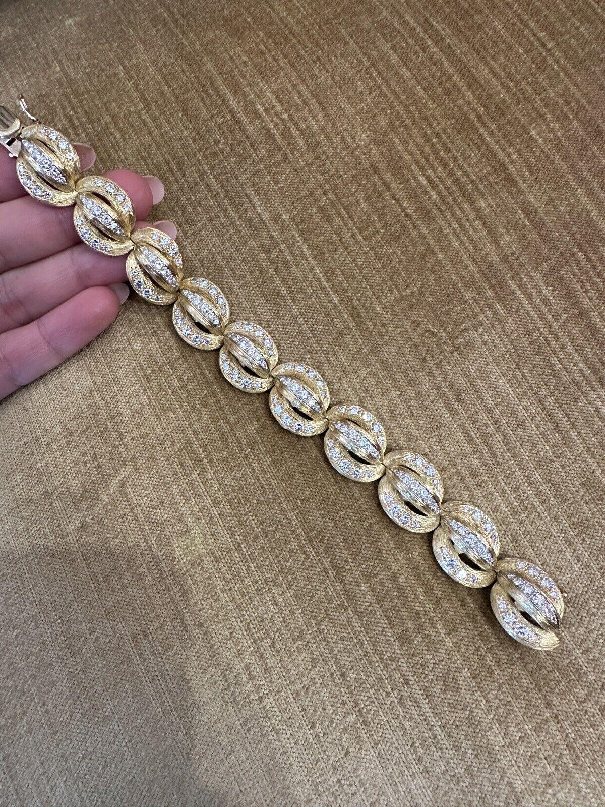 Heavy Vintage Diamond Link Textured Bracelet in 18k Yellow Gold 

The bracelet features 10 textured links with Round Brilliant Diamonds pave set in 18k Yellow Gold. Bracelet is secured by a tongue clasp with safety bar and clasp.

Total diamond