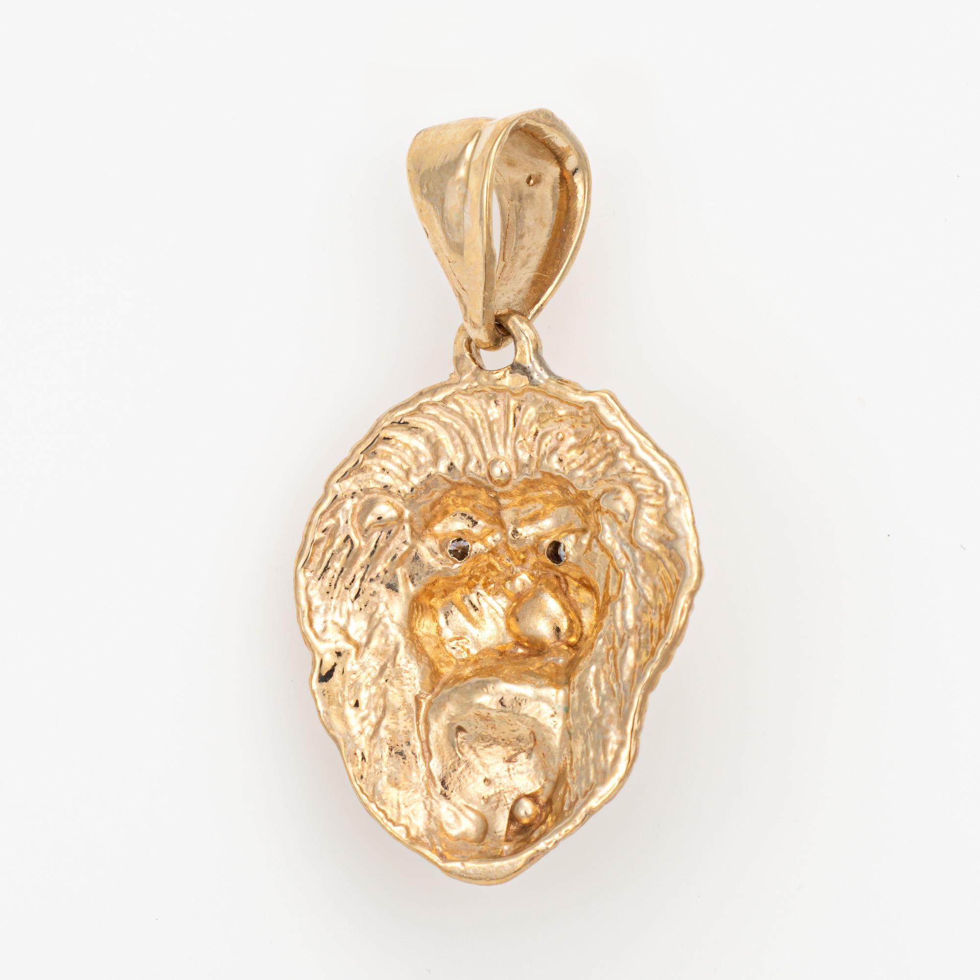 Finely detailed vintage Lion pendant crafted in 10 karat yellow gold (circa 1980s to 1990s). 

Diamonds total an estimated 0.15 carats (estimated at I-J color and SI2-I2 clarity).  

The Lion head is set with a diamond to the mount and two small