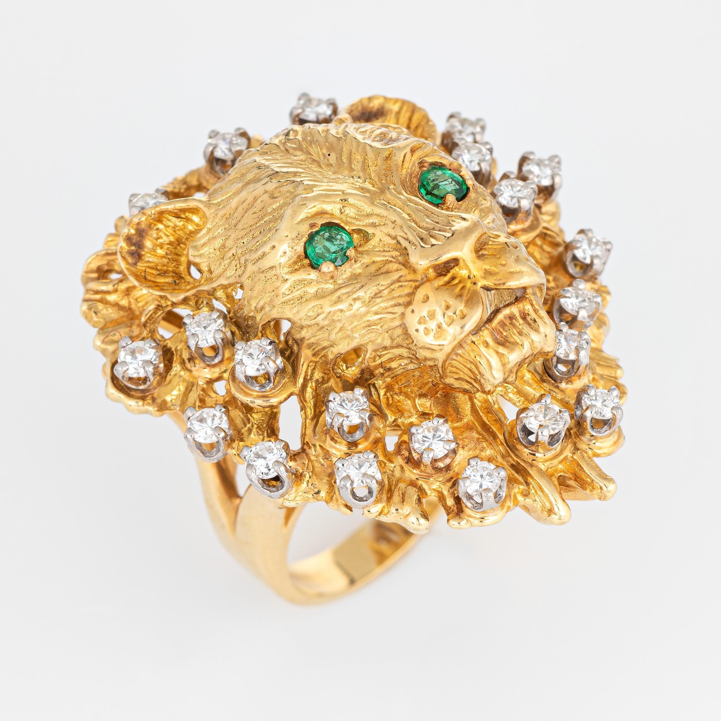 Striking vintage Lion ring set with diamonds and emerald eyes (circa 1960s to 1970s) crafted in 18 karat yellow gold. 

21 diamonds are estimated at 0.03 carats each and total an estimated 0.63 carats (estimated at H-I color and VS2-SI2 clarity).