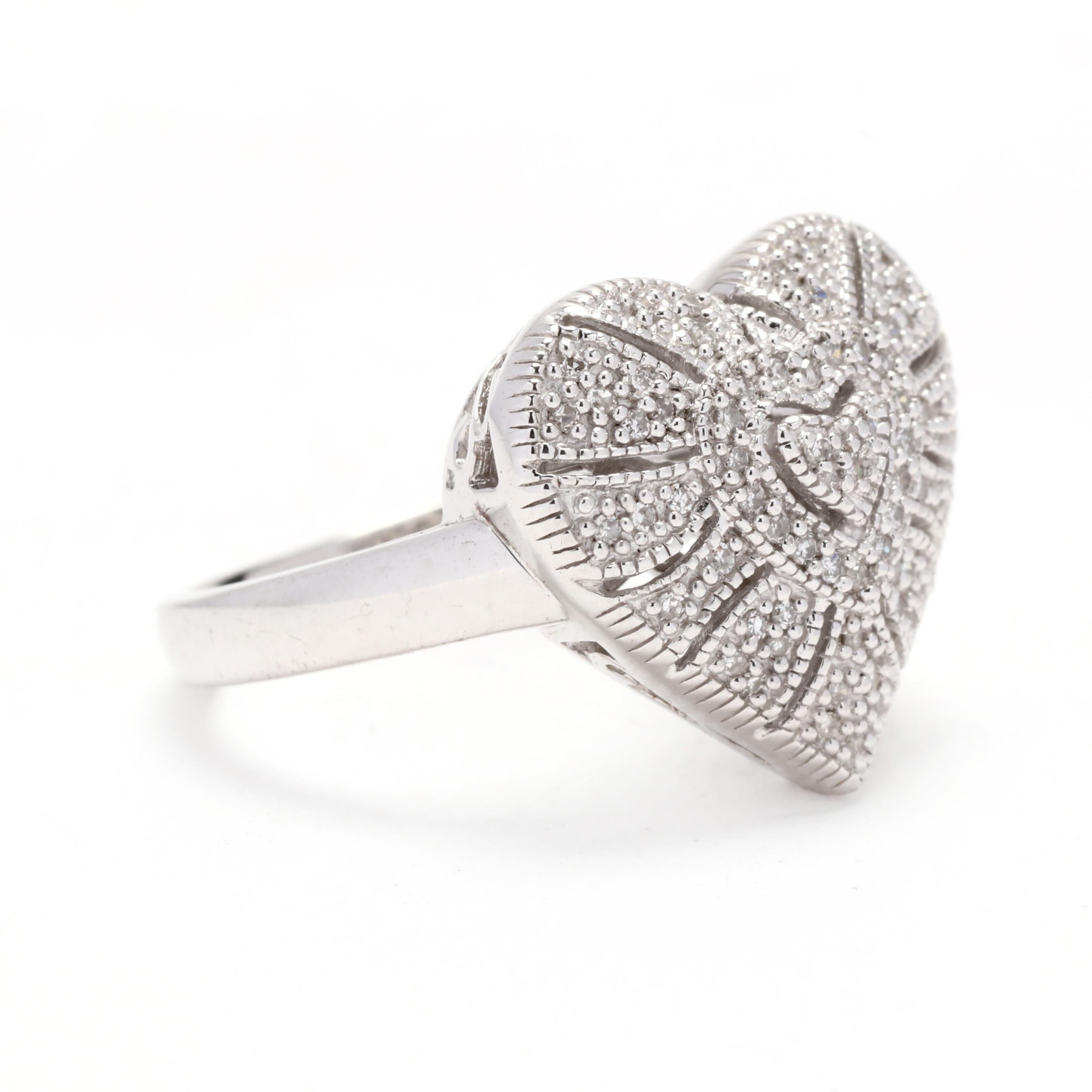 A vintage sterling silver diamond milgrain heart statement ring. This simple ring features a filigree heart motif set with single cut round diamonds with milgrain accents and a tapered band.

Stones:
- diamonds
- single cut round

Ring Size: