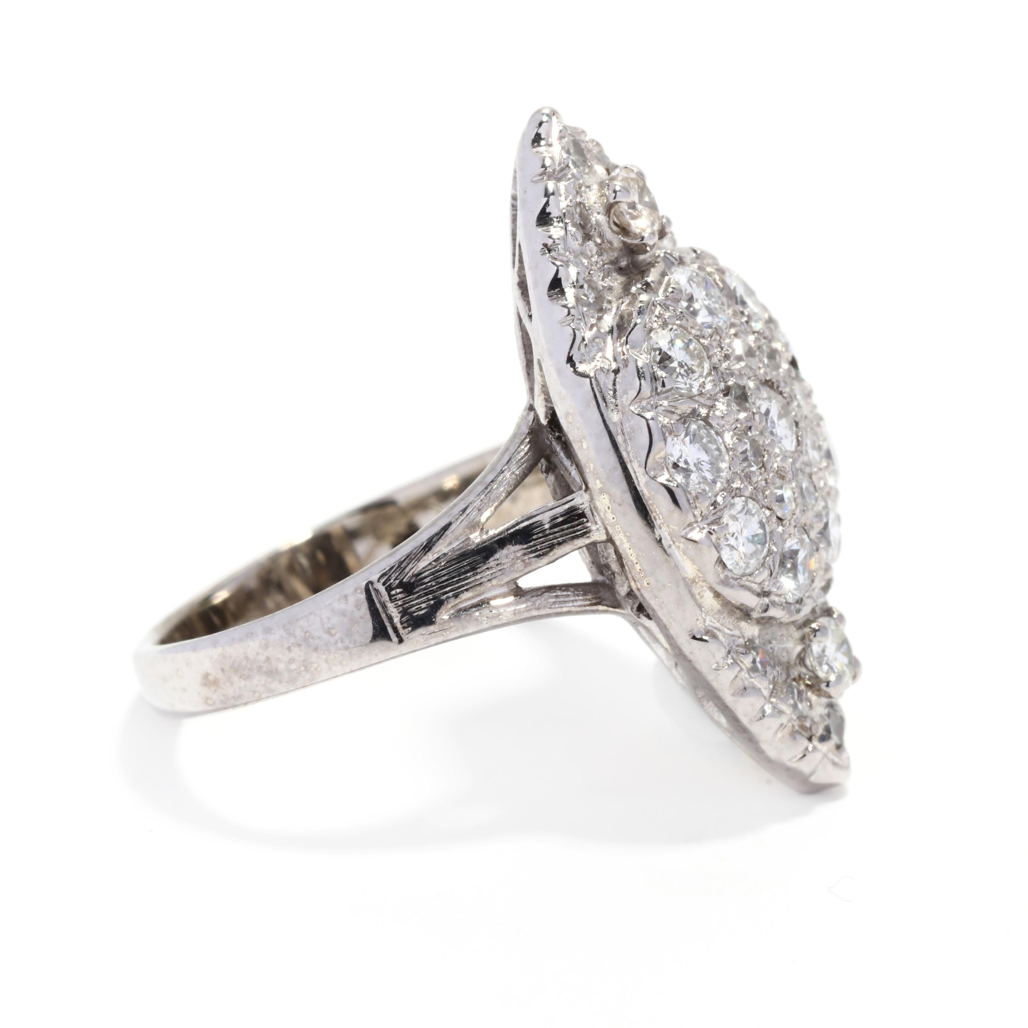 A vintage 14 karat white gold diamond navette ring. This cluster ring features a marquise shape with prong set, round brilliant and single cut diamonds weighing approximately 1 total carat and with a split band.

Stones:
- diamonds, 30 stones
-