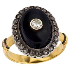 Anello vintage con diamante e onice in oro giallo 18 carati e argento
