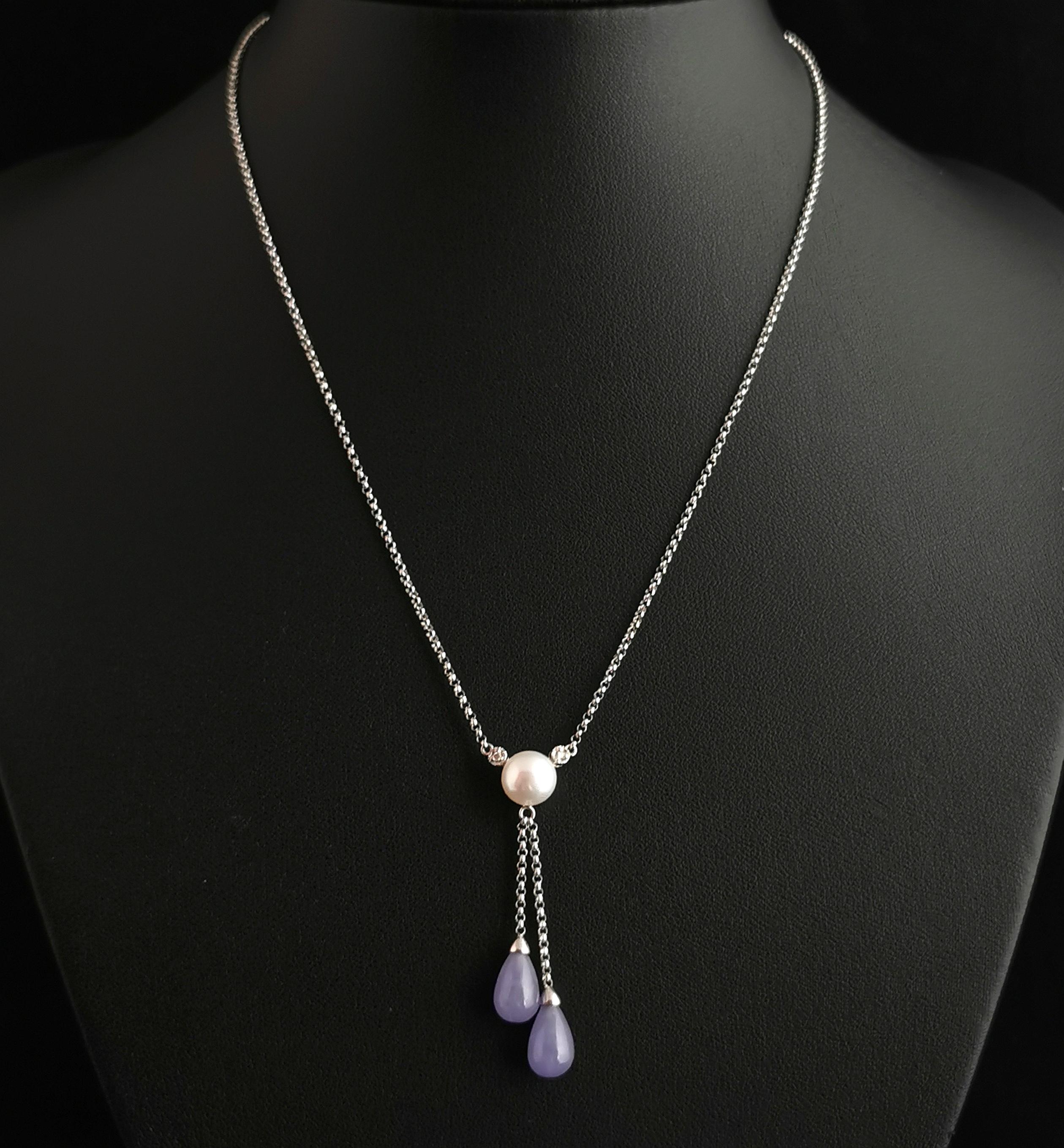 A beautiful vintage lavender jade, Diamond and pearl lariat necklace.

It is a delicate and feminine piece, crafted in the Art Deco style, it has a fine trace link white gold chain and the Y drop starts at a cool and creamy cultured pearl,
