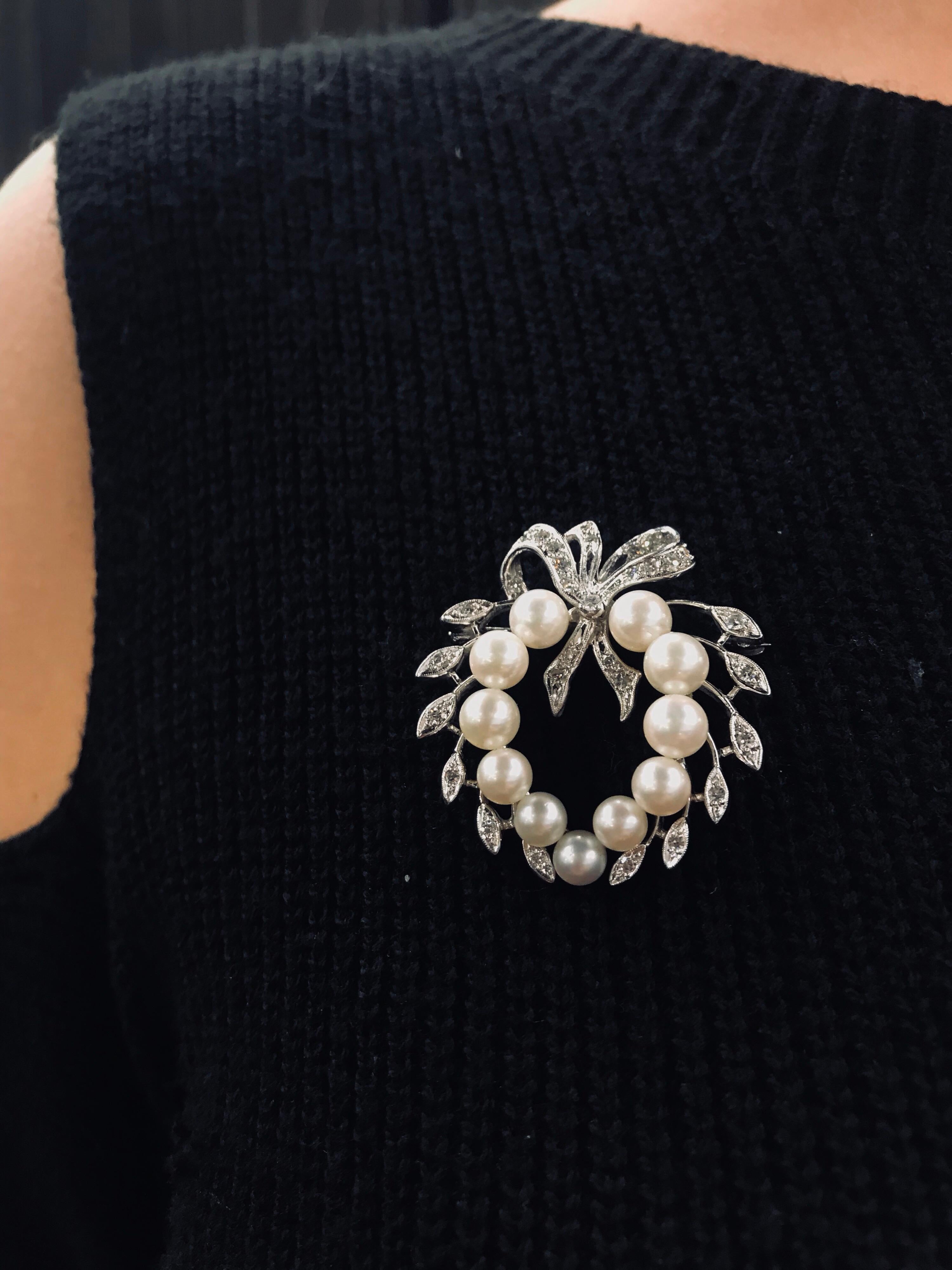 Vintage diamond and pearl brooch featuring 31 diamonds and 11 white pearls. 
Can be turned into a pendant.