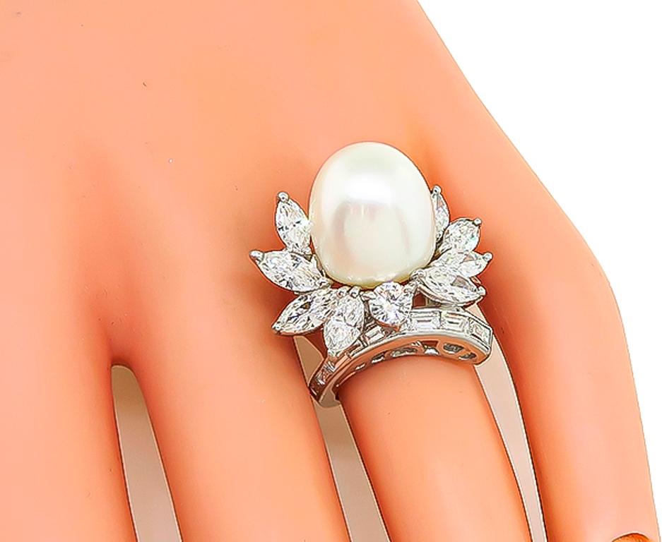 This stunning platinum cocktail ring from the 1950s features a lovely south sea pearl accentuated by sparkling marquise, round and baguette cut diamonds that weigh approximately 3.00ct graded G-H color with VS clarity. The top of the ring measures